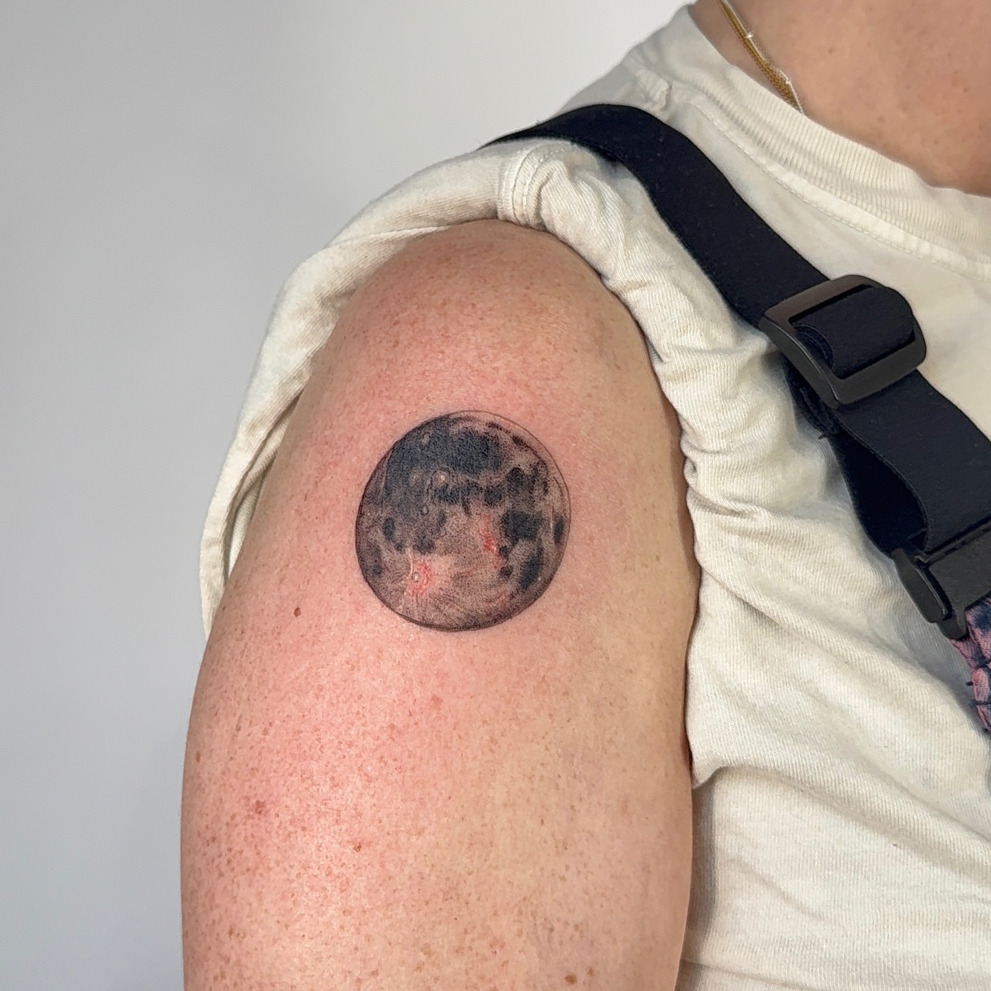 Moon realism tattoo on the shoulder by bre