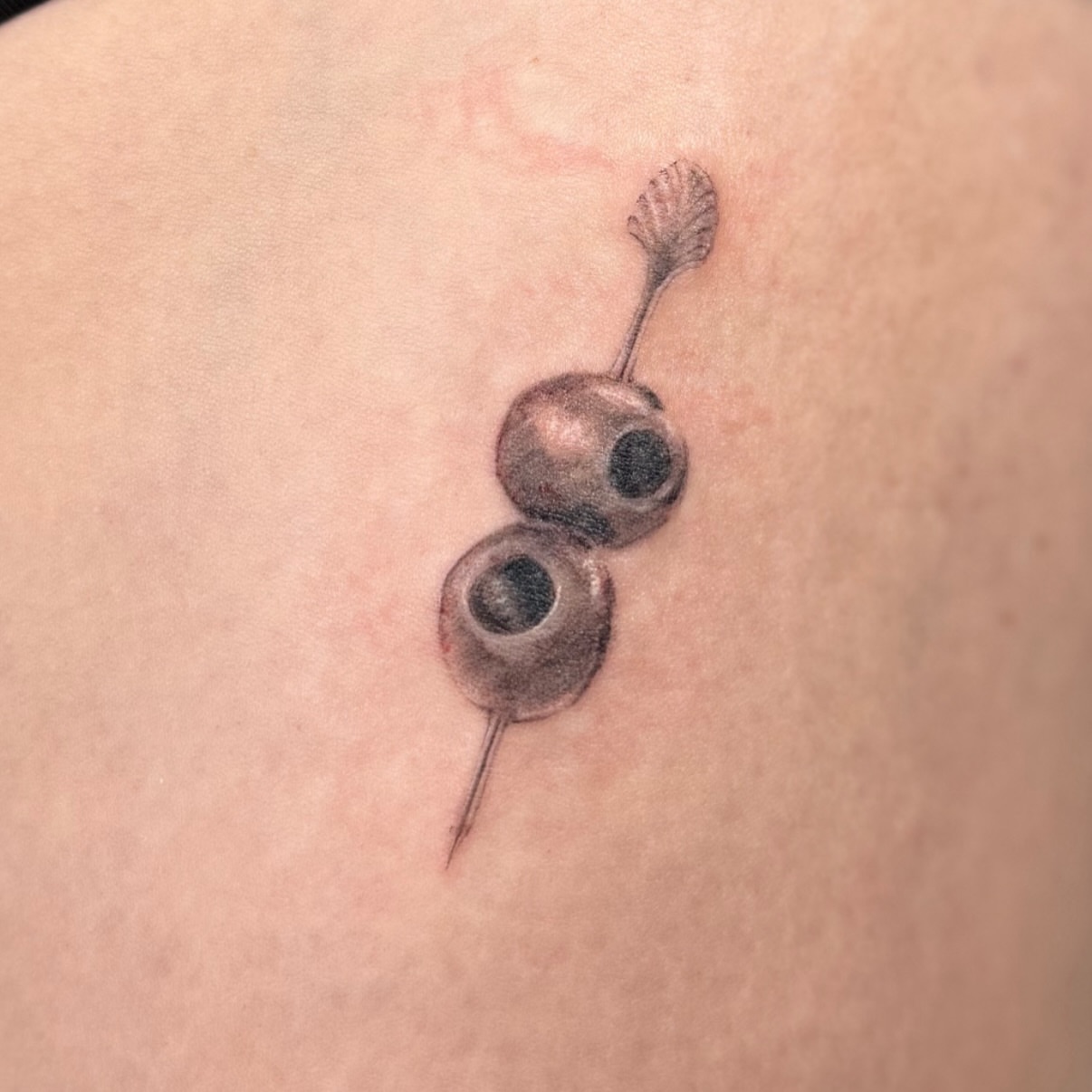 Cherry realism tattoo on the shoulder by bre