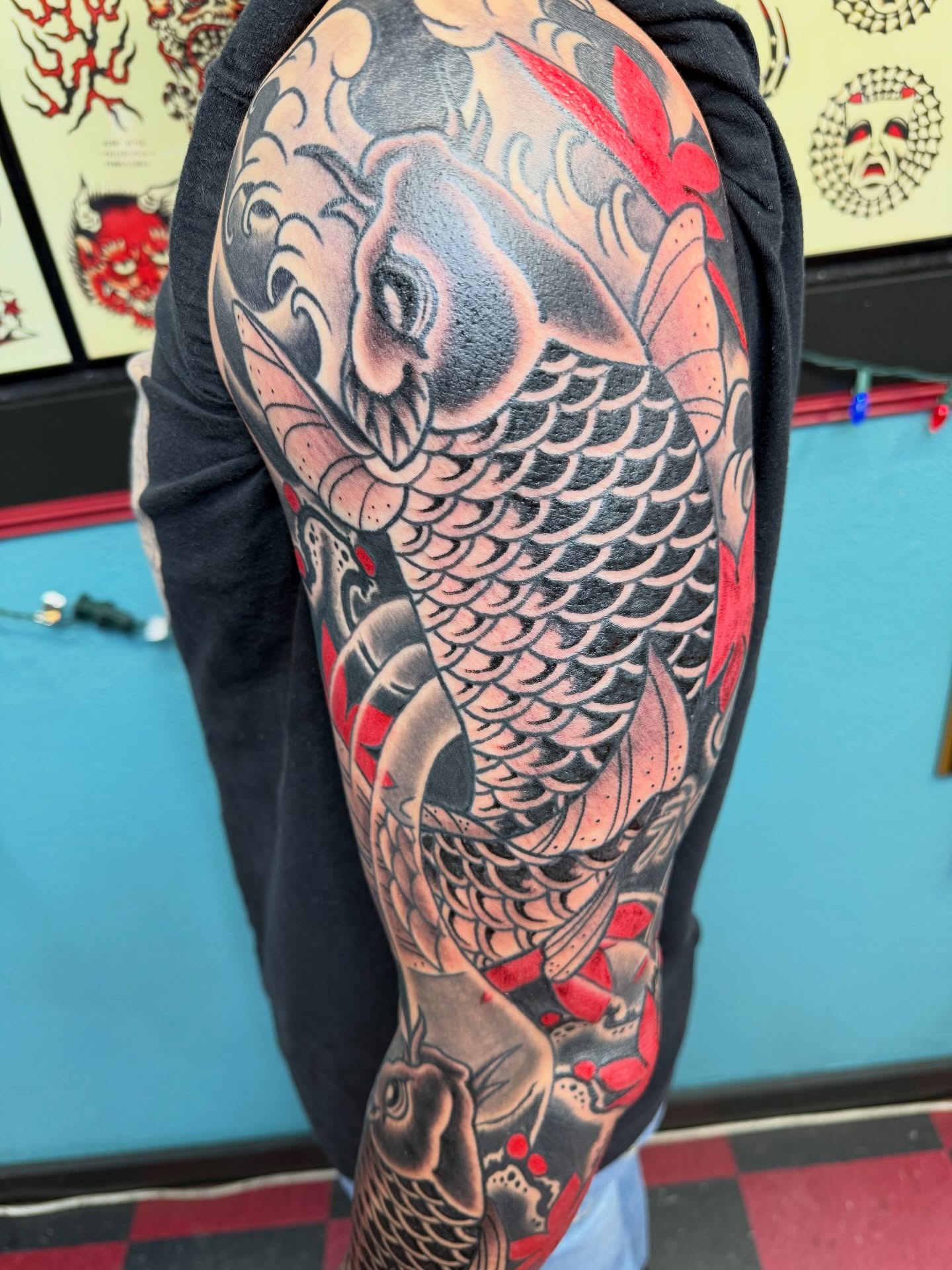 Koi fish American traditional tattoo on the forearm by DemianThompson