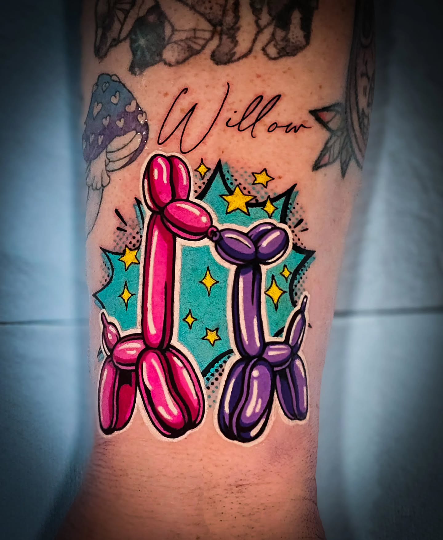 Balloon animals new school tattoo on the forearm by Mel Michelle