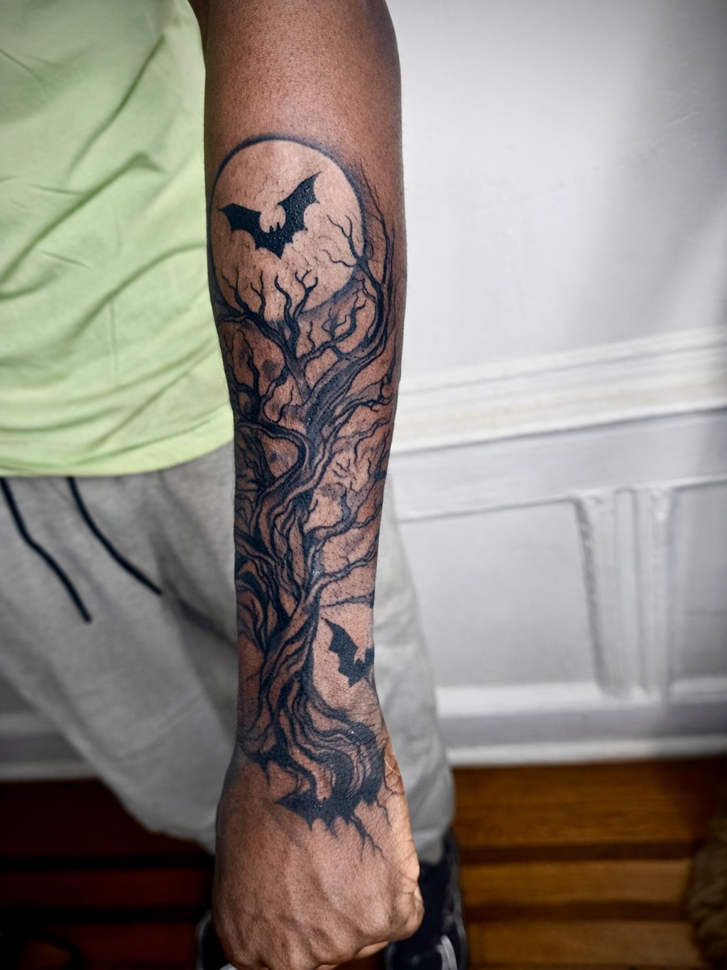 Haunted tree with bats and moon dark art tattoo on the forearm by JayyeSosa