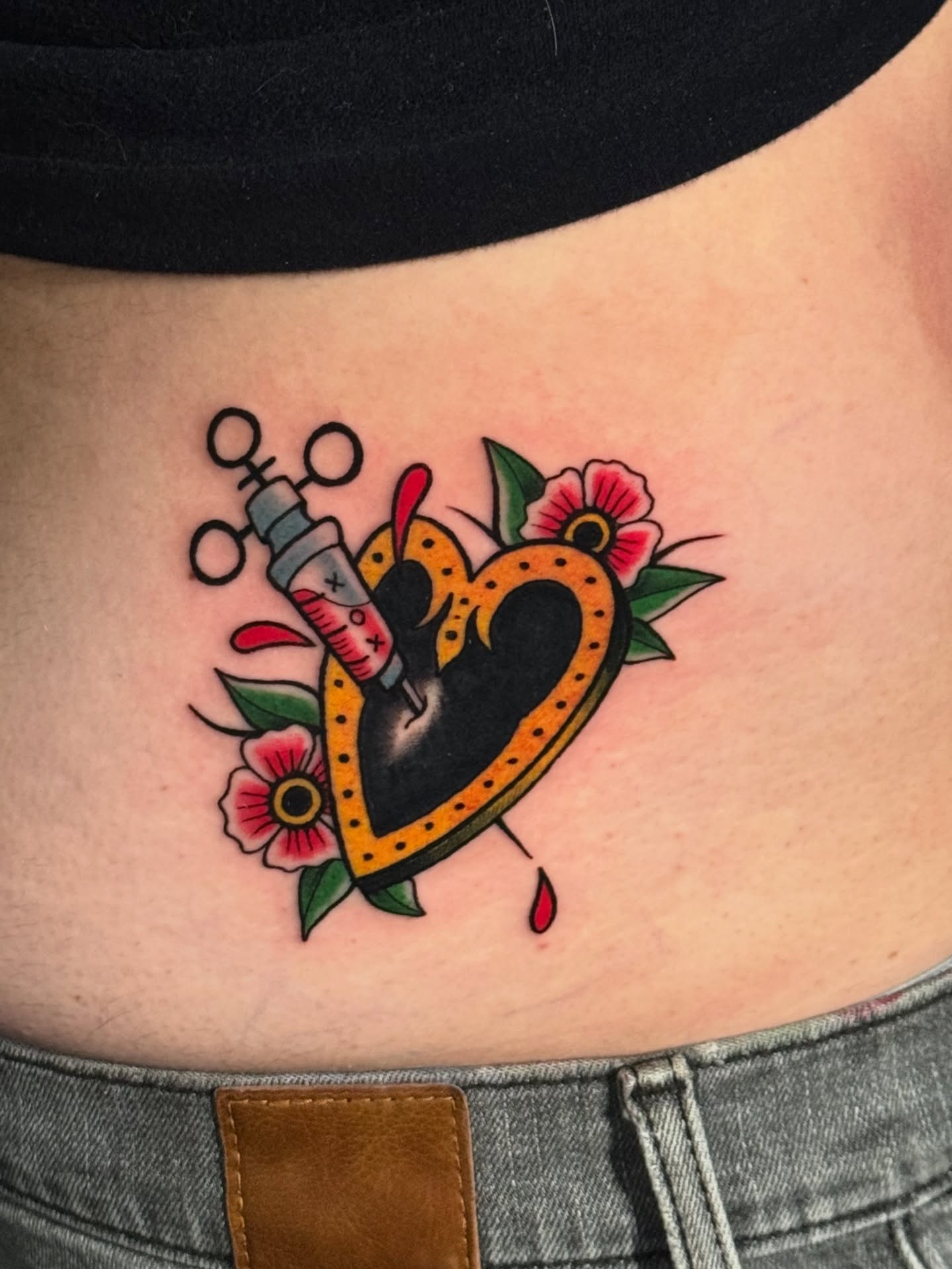 Heart with syringe American traditional tattoo on the ribs by HAiZiE