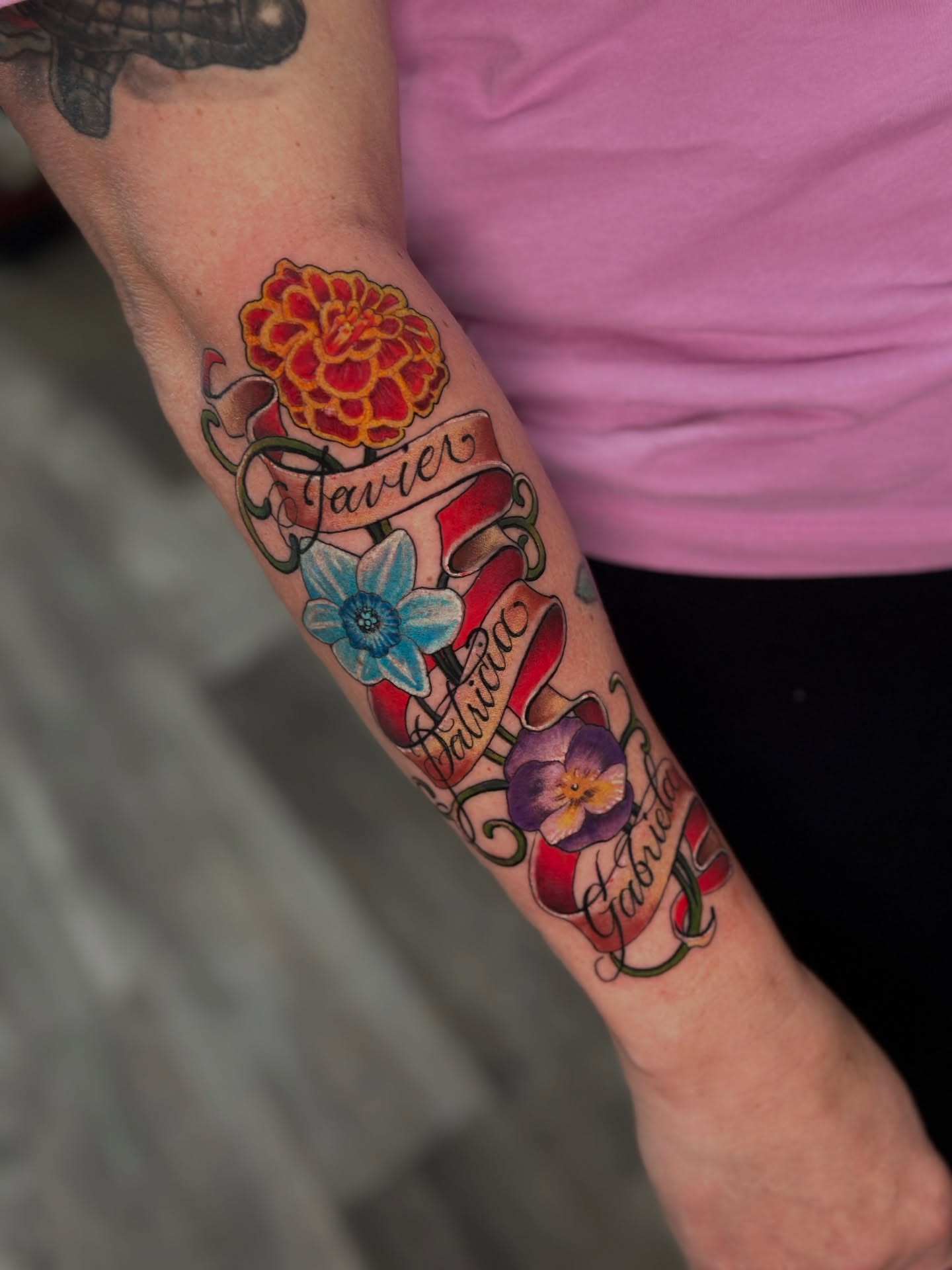 Flower bouquet American traditional tattoo on the forearm by Skoty Fox