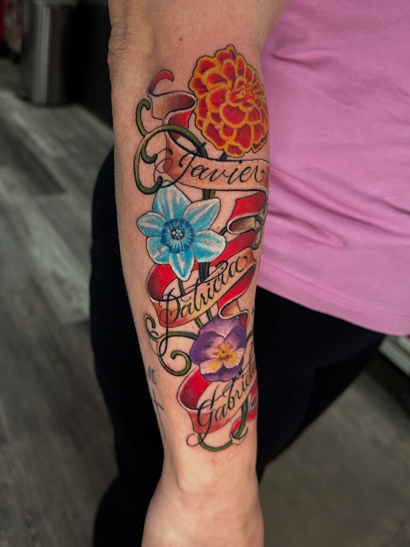 Floral bouquet American traditional tattoo on the forearm by Skoty Fox
