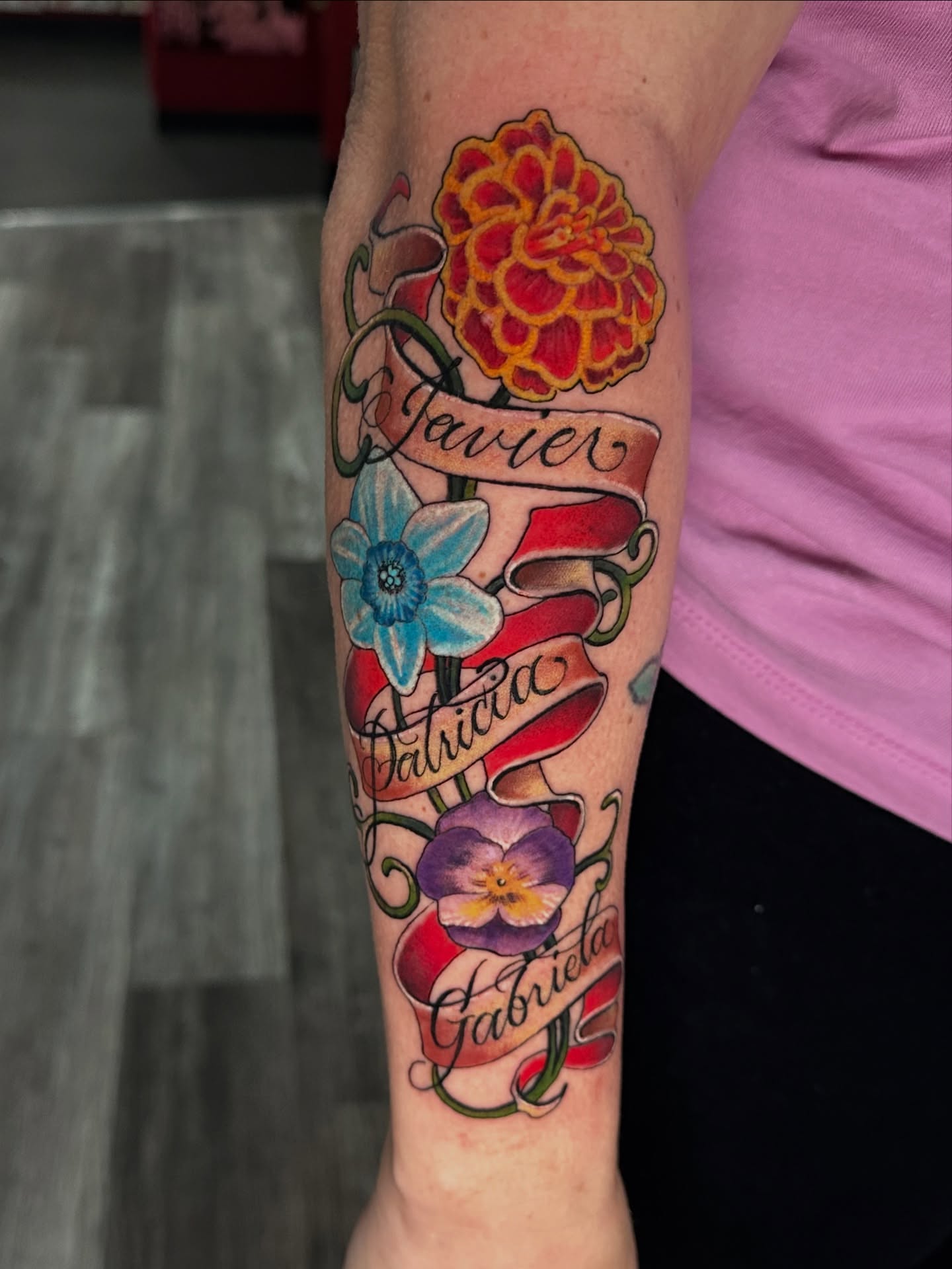 Flower bouquet American traditional tattoo on the forearm by Skoty Fox