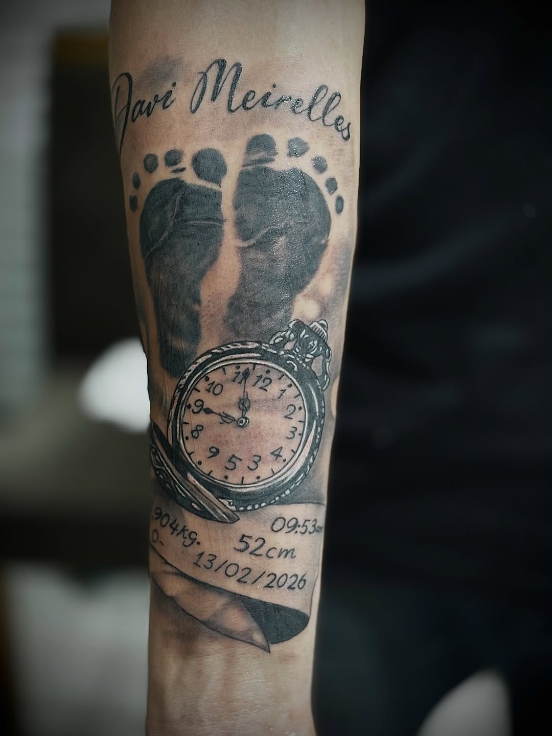 Baby footprints, watch, and birth details Chicano tattoo on the forearm by Mauricio gois