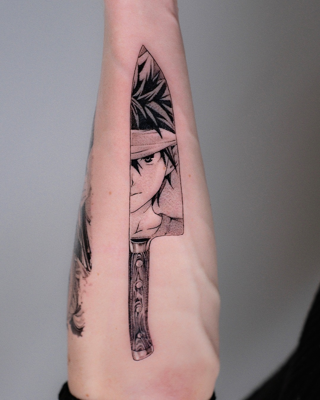 Knife with anime character dotwork tattoo on the forearm by Anime, Amsterdam, Noord-Holland