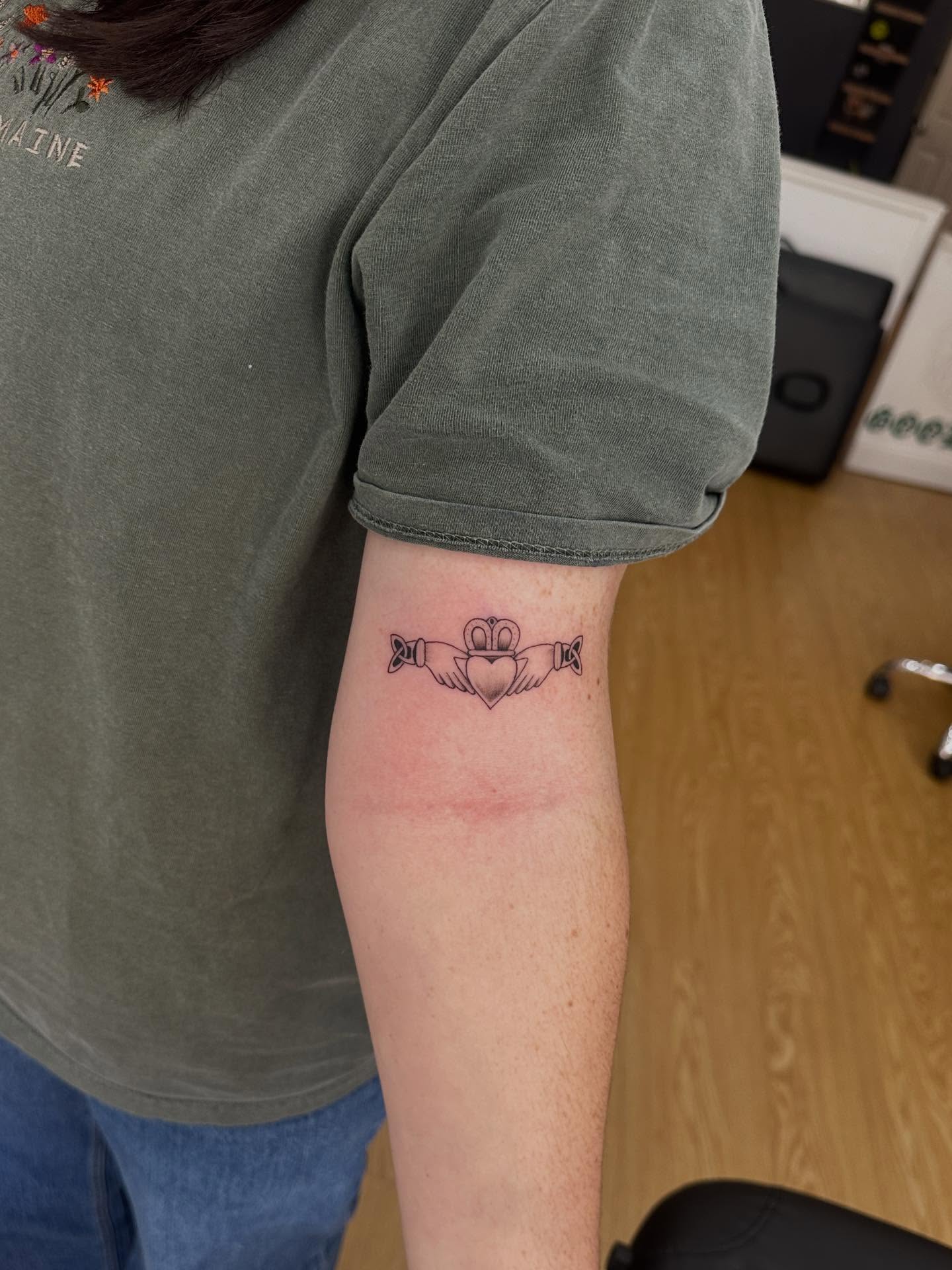 Claddagh ring black and grey tattoo on the forearm by Matt Kearney