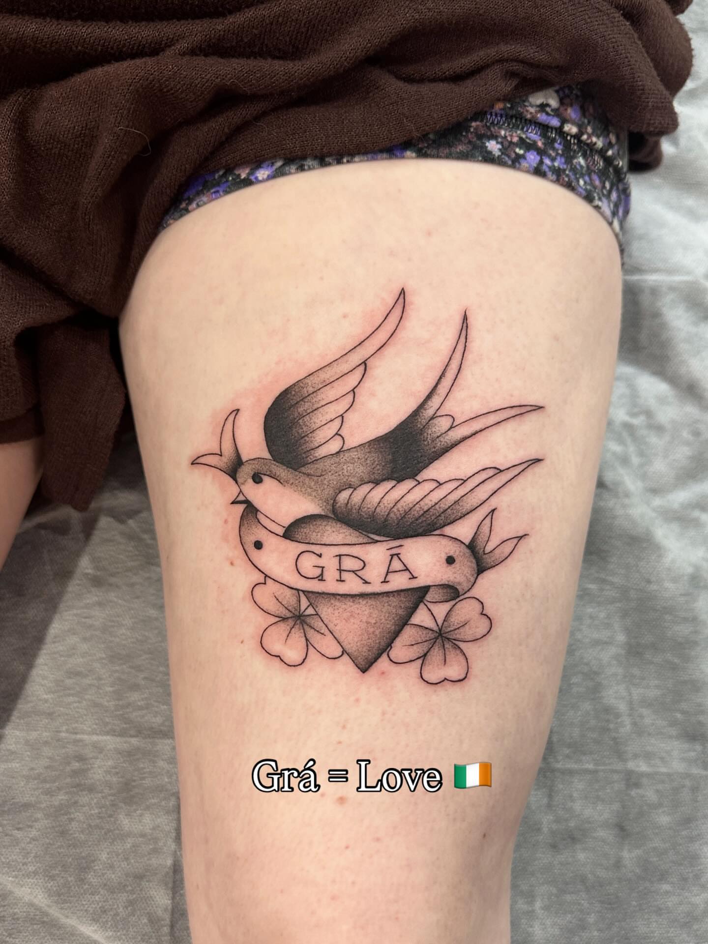 Swallows and heart American traditional tattoo on the thigh by Matt Kearney