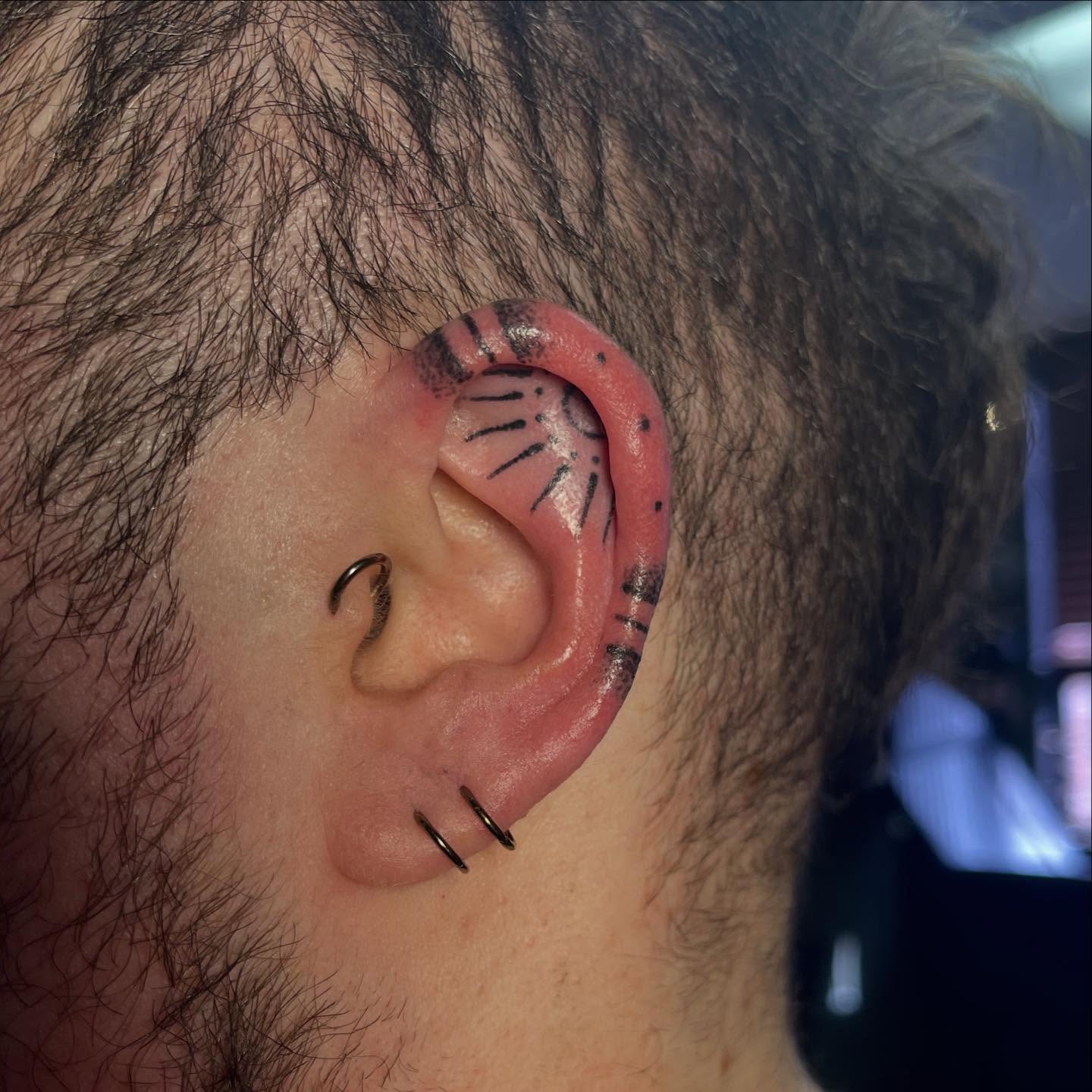 Cat ear dotwork tattoo by Permanent Pokes