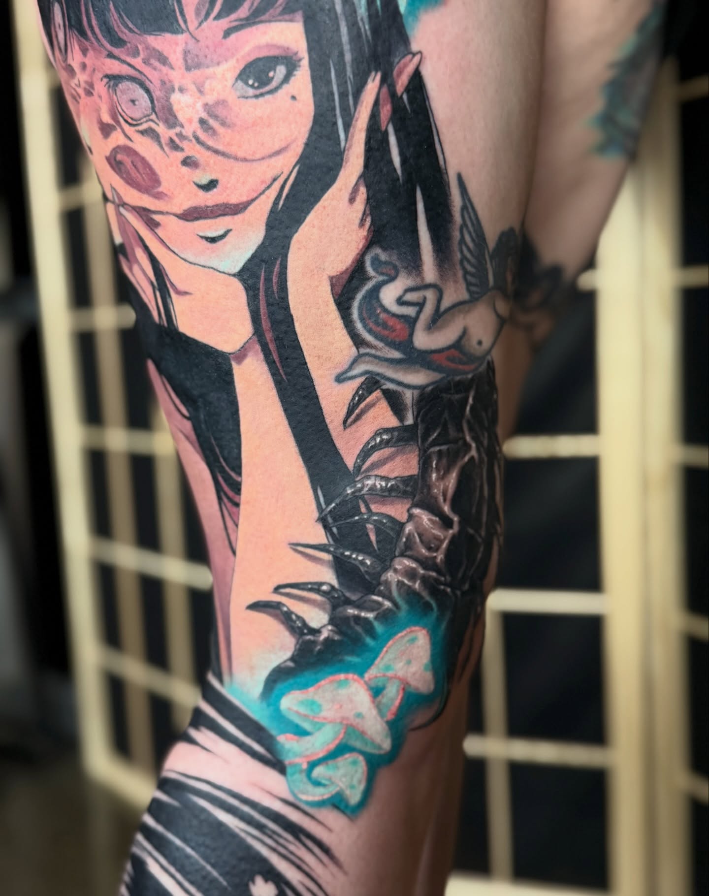 Woman with snake anime tattoo on the forearm by Miles Haysmith