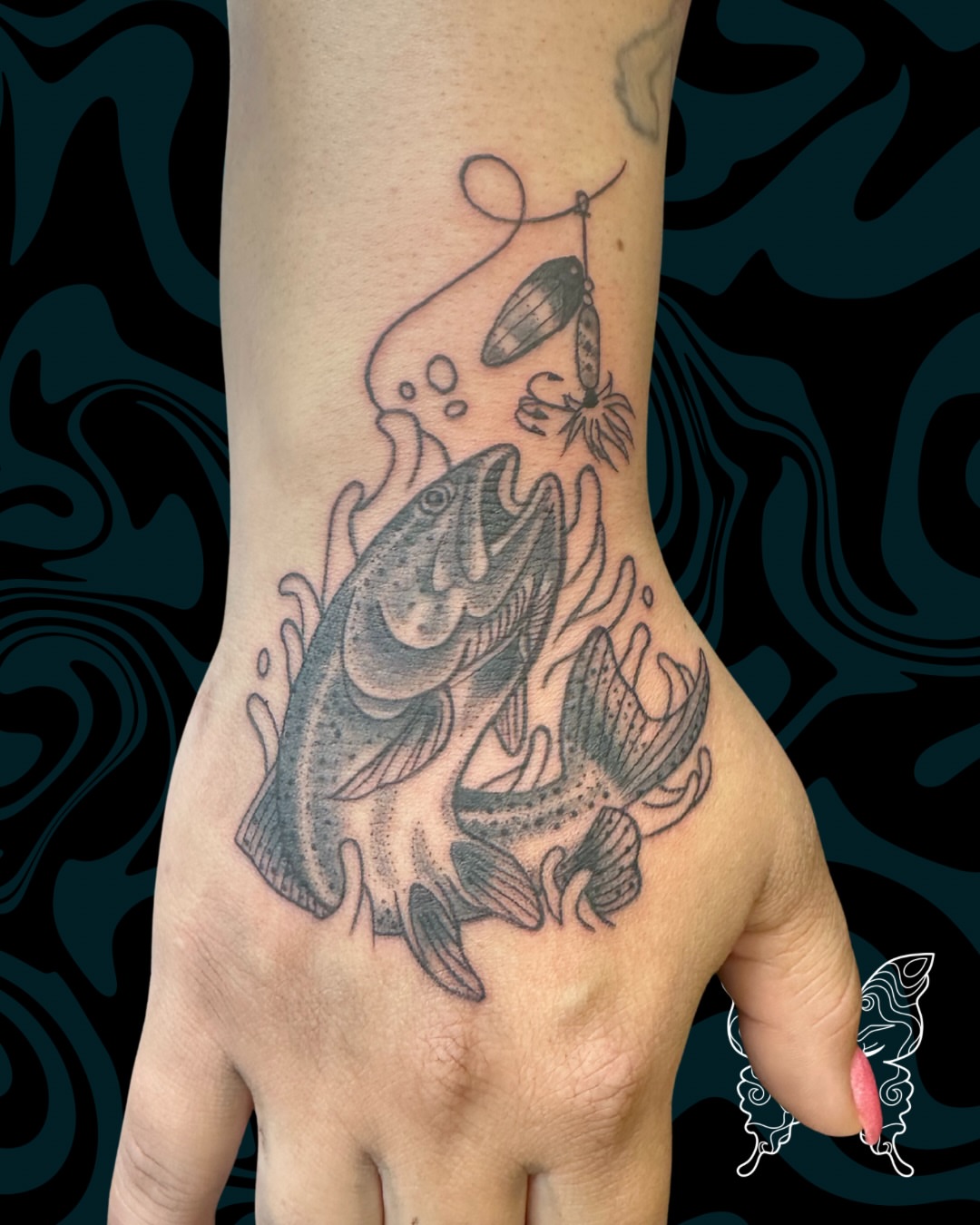 Fish jumping black and grey tattoo on the hand by Nicci