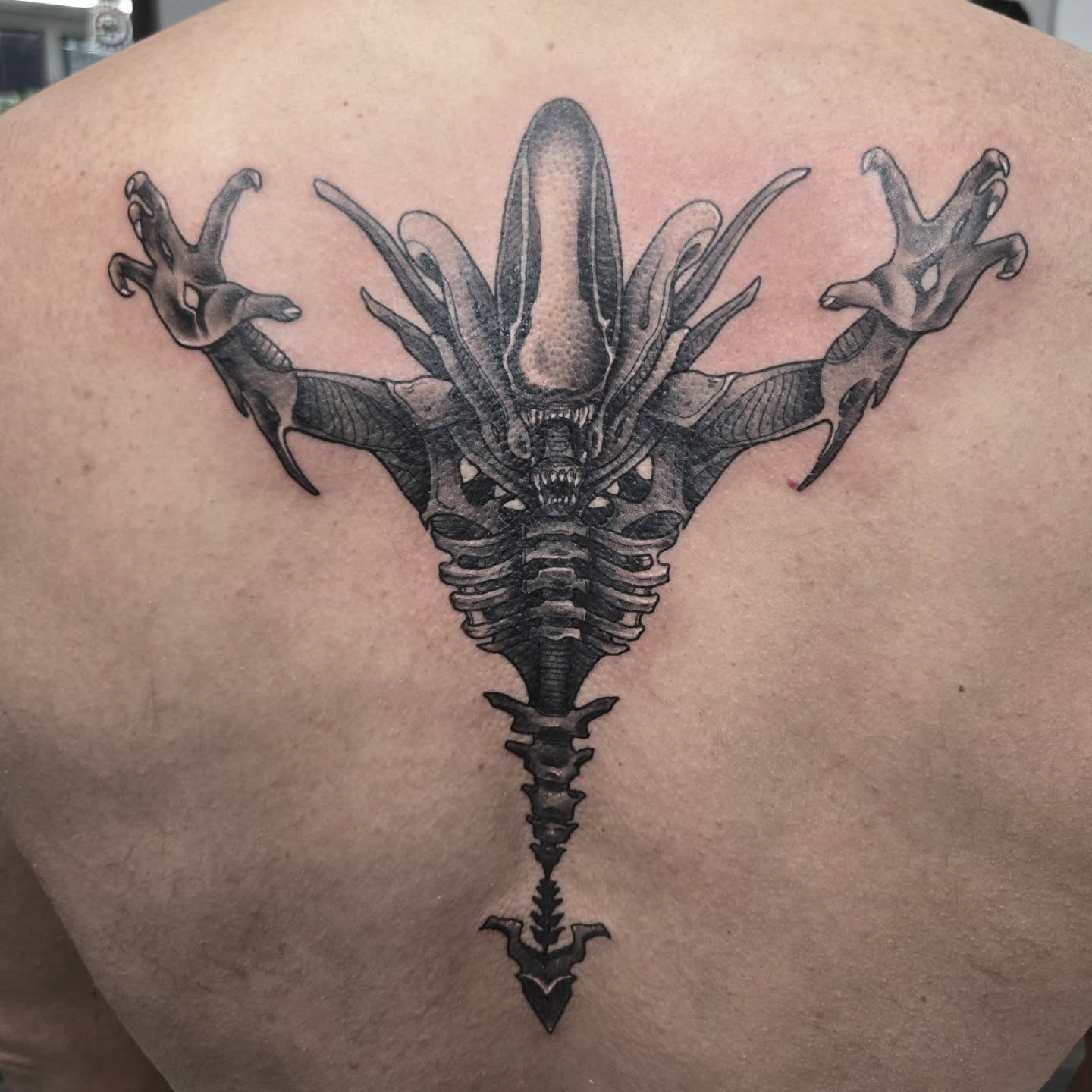 Alien creature geometric tattoo on the back by Britty Love, Nashville, Tennessee