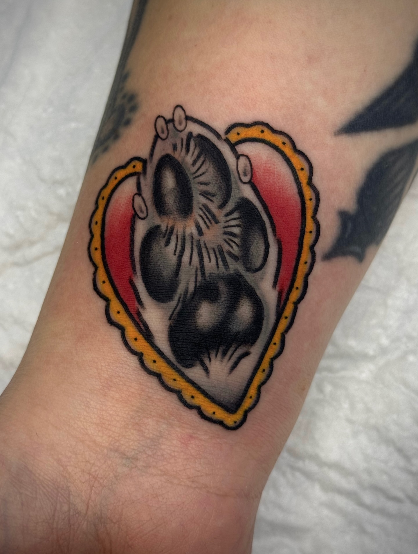 Heart with mechanical organ American traditional tattoo on the forearm by Black and color tattoo!