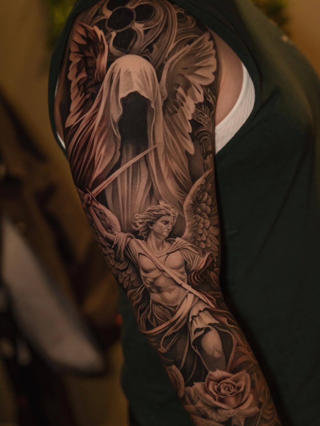Angelic figures and rose realism tattoo on the forearm by @kotytattoos