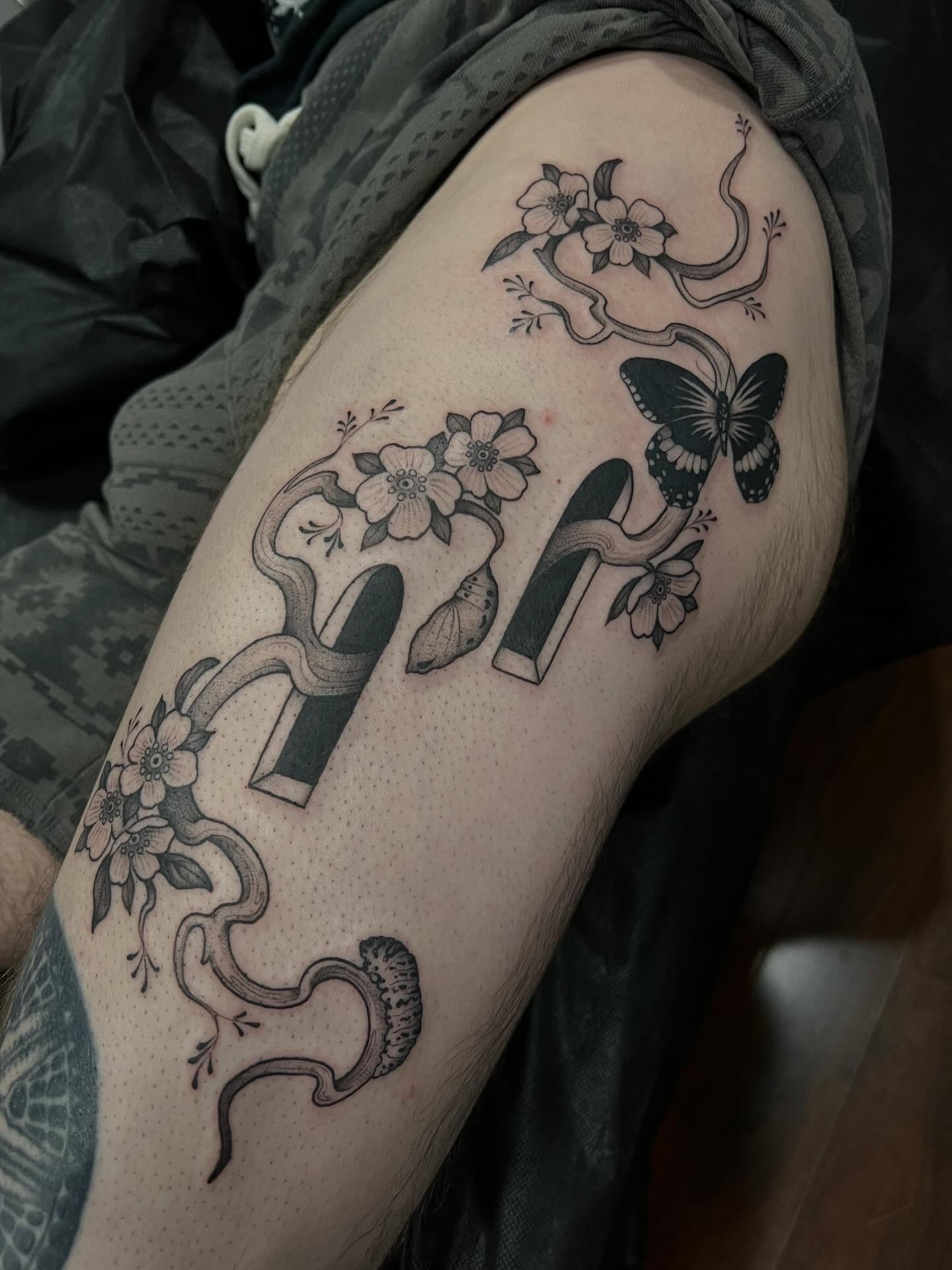 Cherry blossoms and butterfly dotwork tattoo on the forearm by Avrey Simone