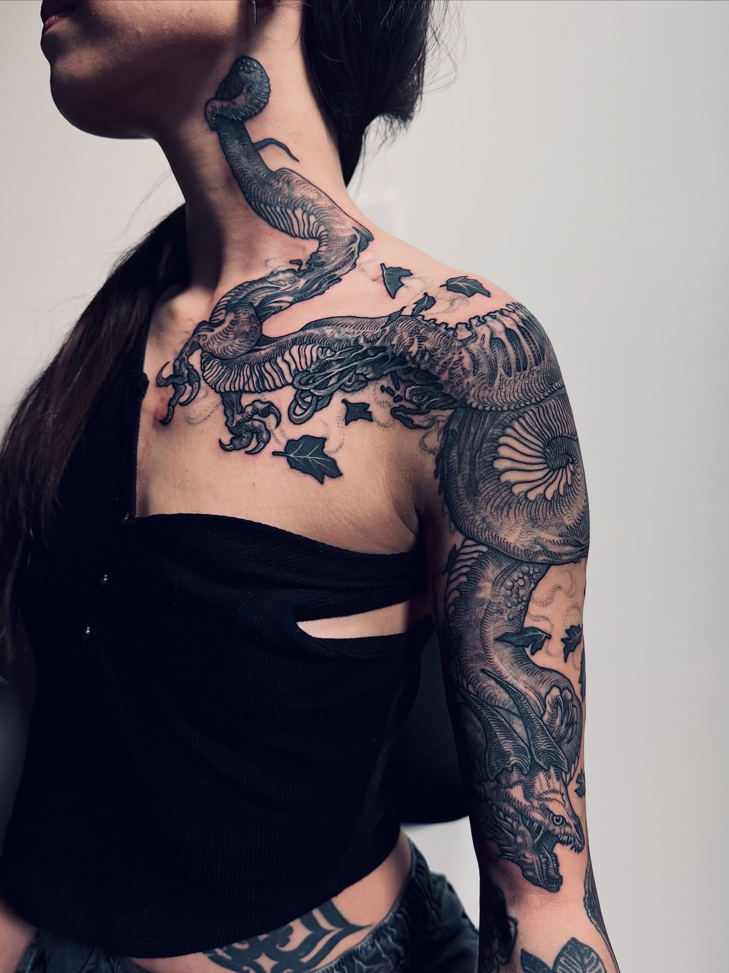 Dragon realism tattoo on the shoulder by Landon Morgan