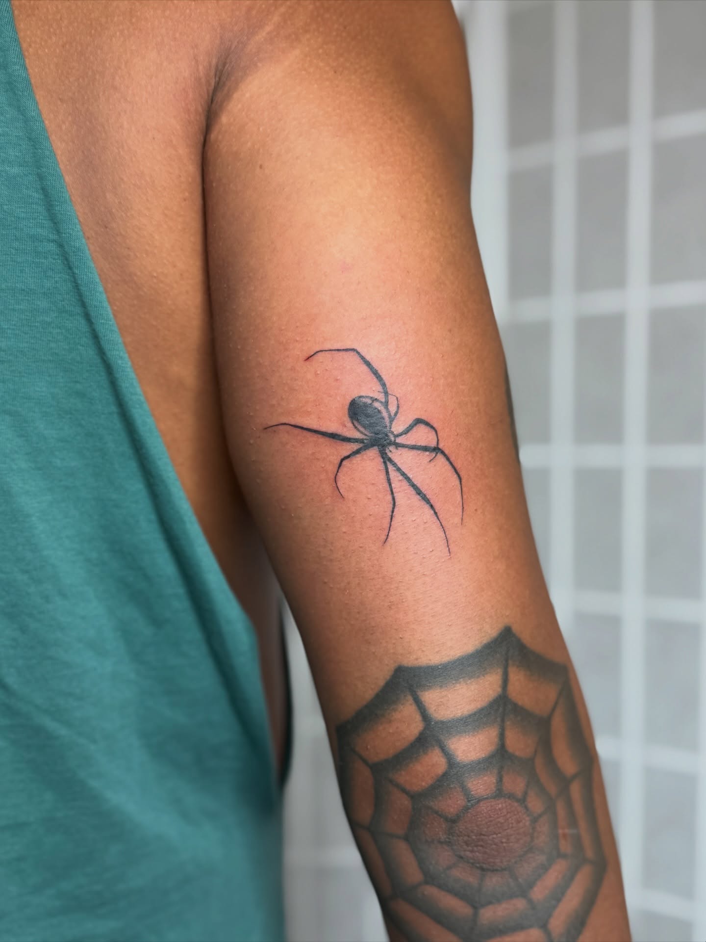 Spider black and grey tattoo on the forearm by Dama