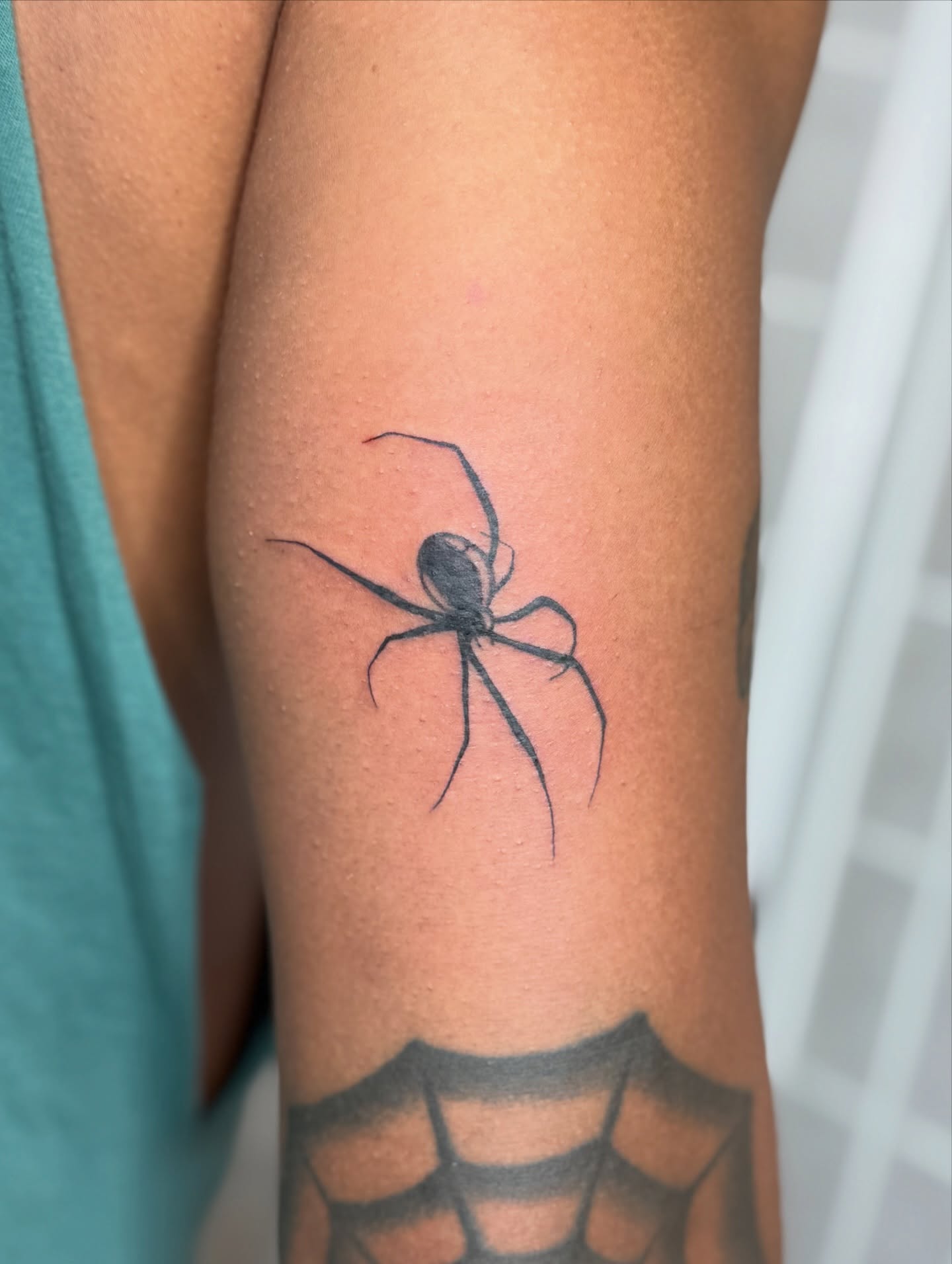 Spider black and grey tattoo on the forearm by Dama