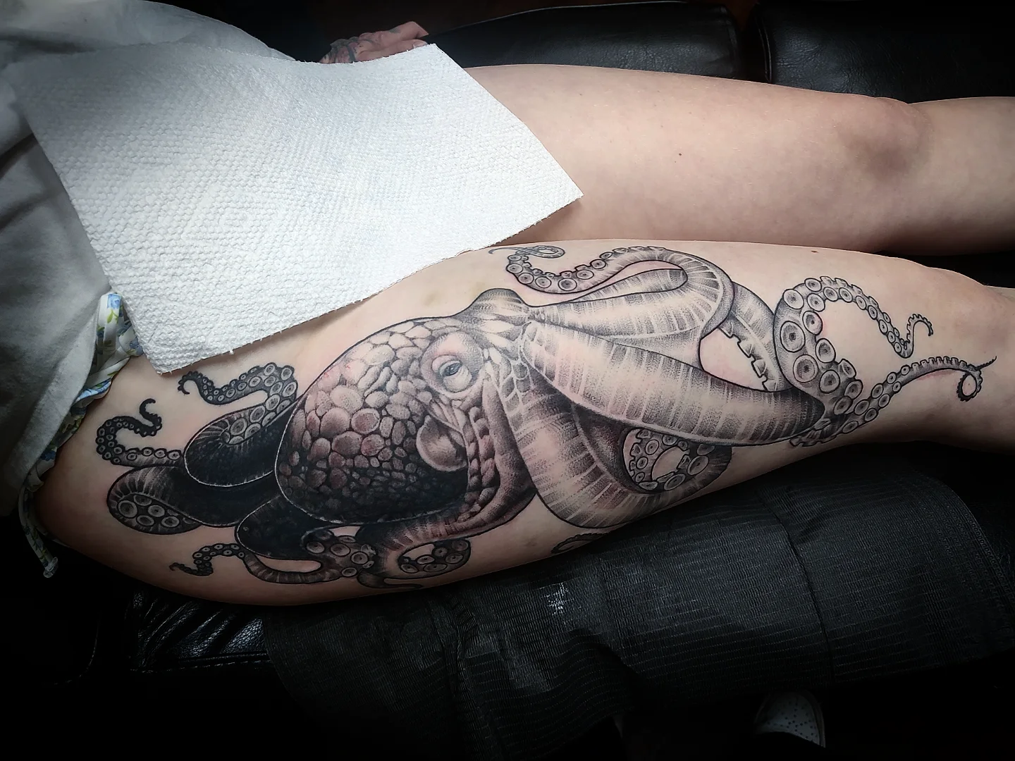 Octopus realism tattoo on the thigh by Jennifer Fowler