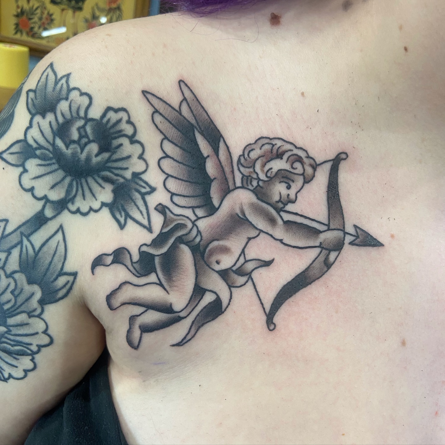 Cherub and flowers American traditional tattoo on the shoulder by nicholas mcevoy, Boston, Massachusetts