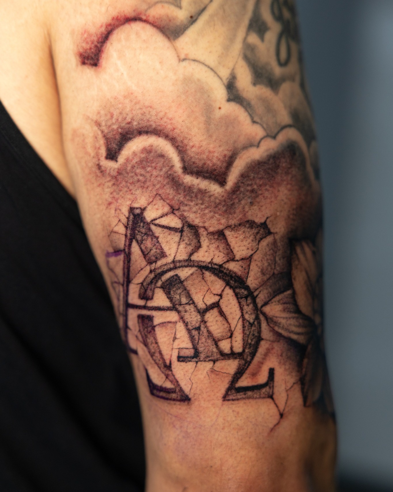 Cracked glass geometric tattoo on the forearm by Absolute