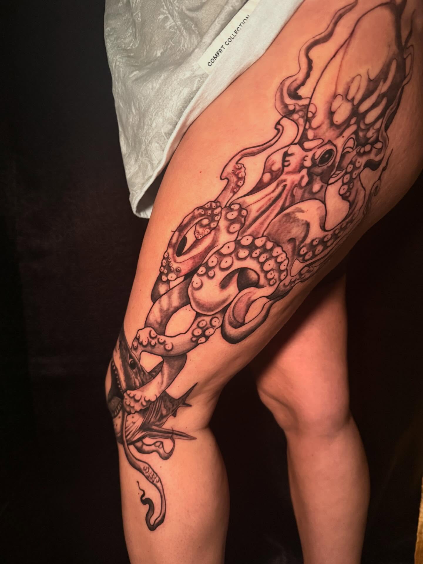 Octopus black and grey tattoo on the thigh by Nicholas A. Estes-Davis