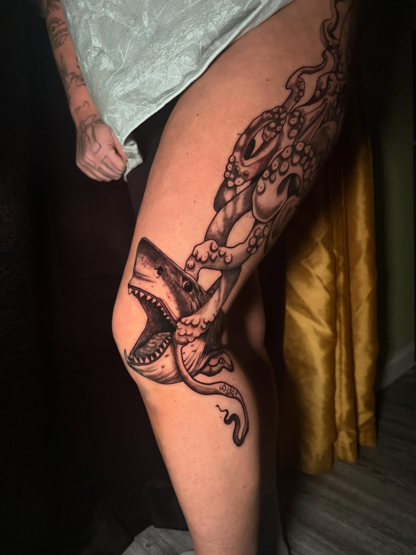 Shark and octopus black and grey tattoo on the thigh by Nicholas A. Estes-Davis
