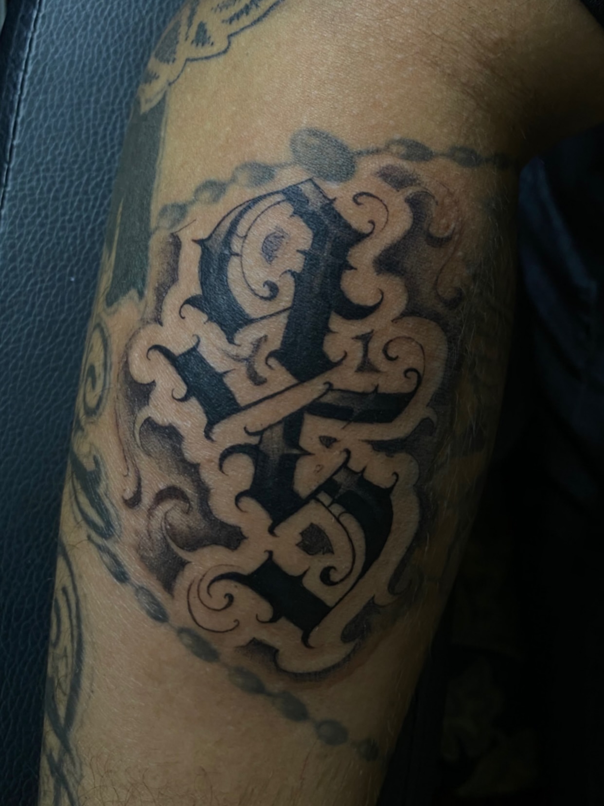 Ornamental lettering ornamental tattoo on the forearm by Shadoww Espinoza
