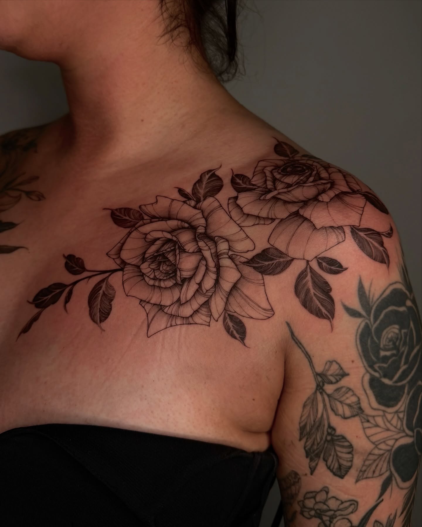 Roses black and grey tattoo on the shoulder by Sab