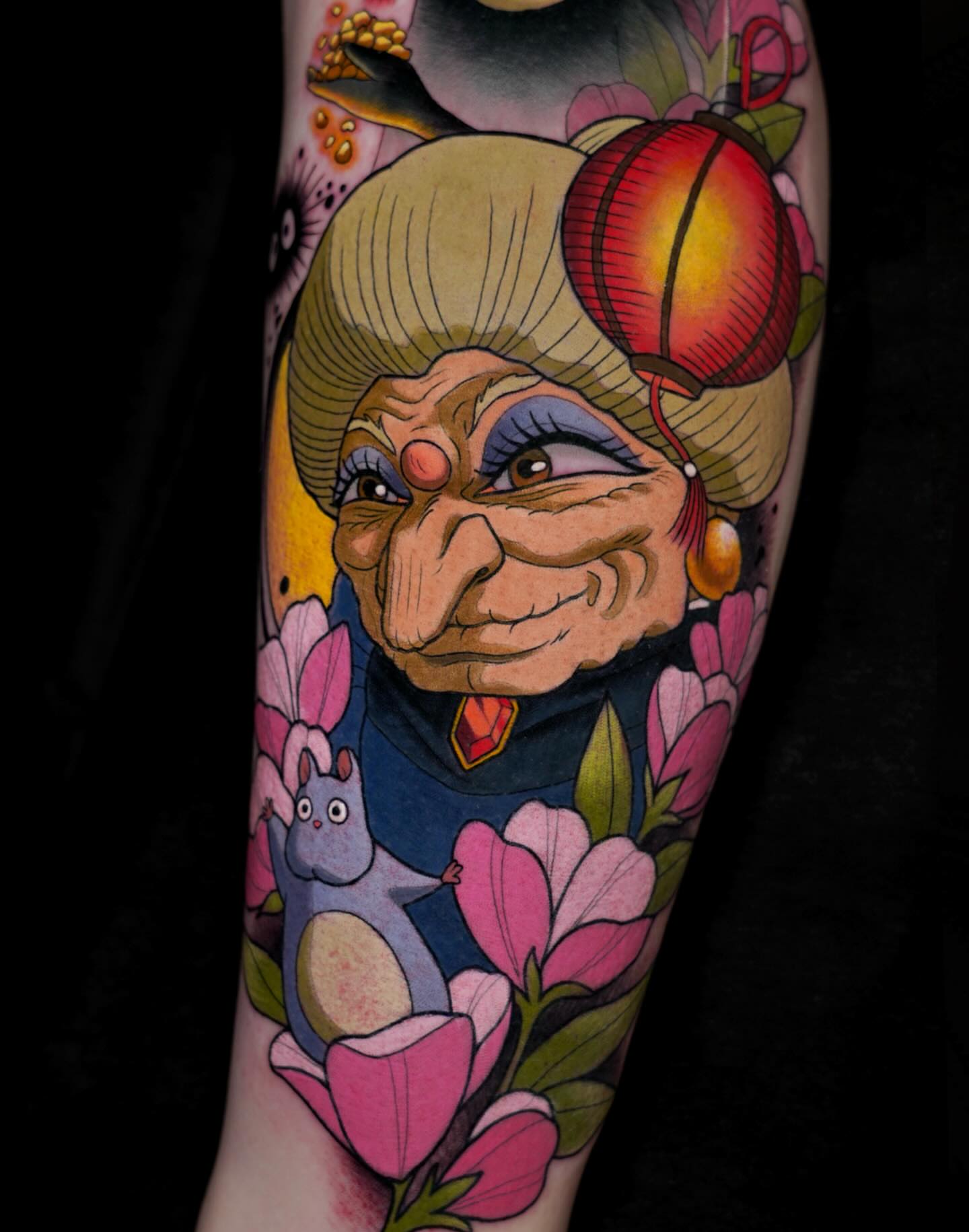 Old woman with rabbit American traditional tattoo on the forearm by Brooke Borden