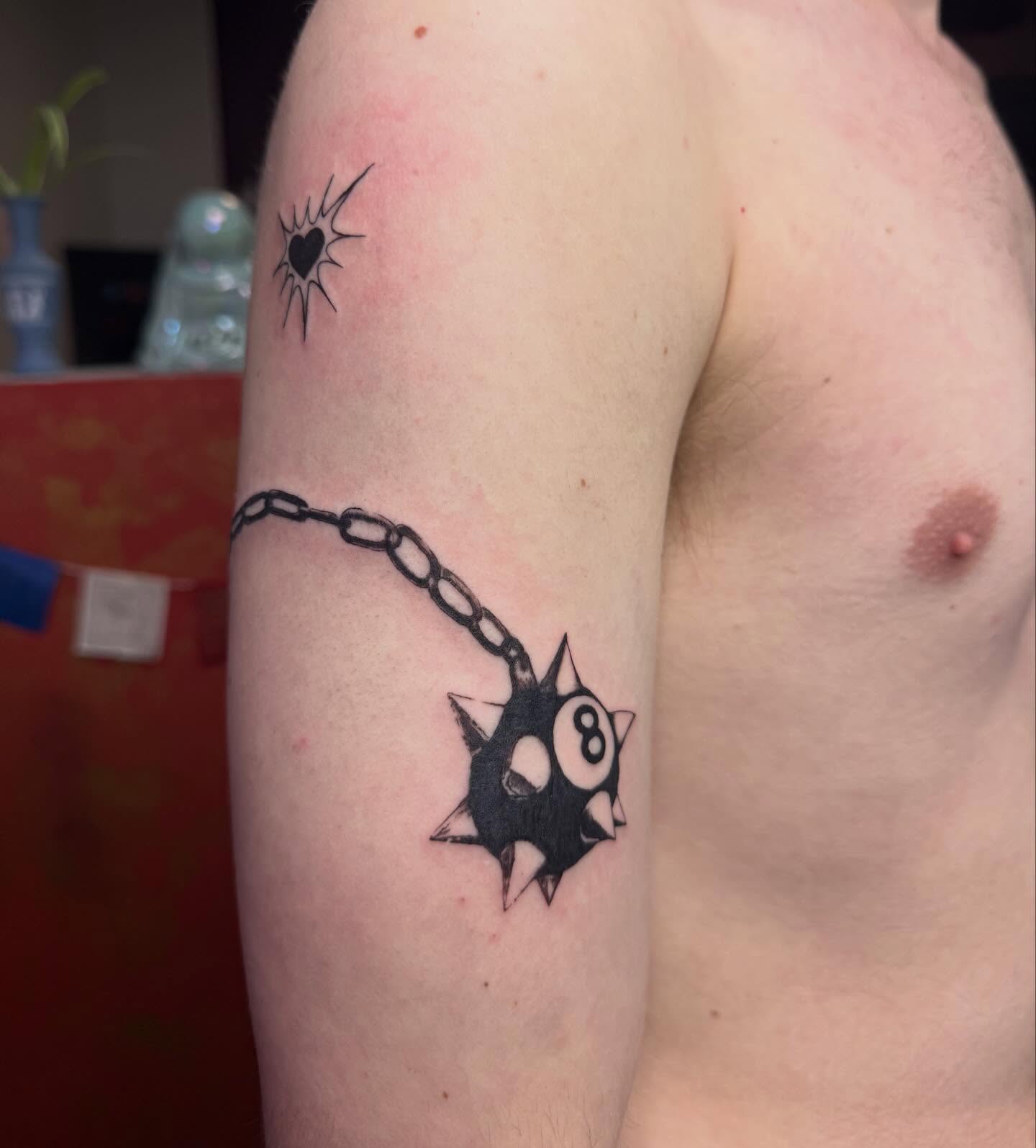 8-ball black and grey tattoo on the forearm by Imani