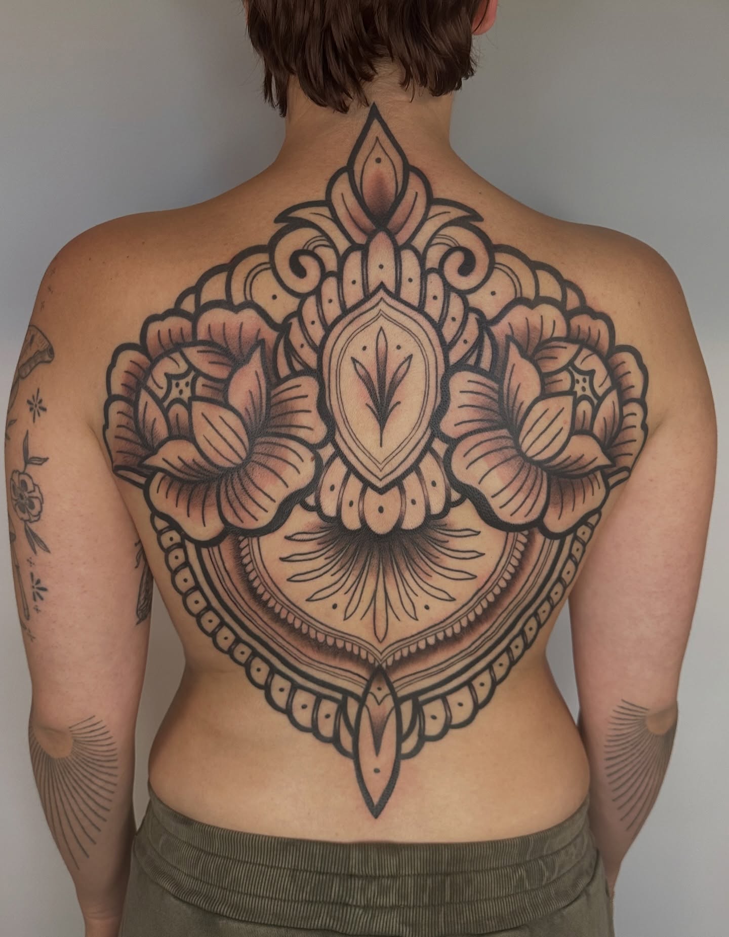 Floral mandala American traditional tattoo on the back by Summer Shield