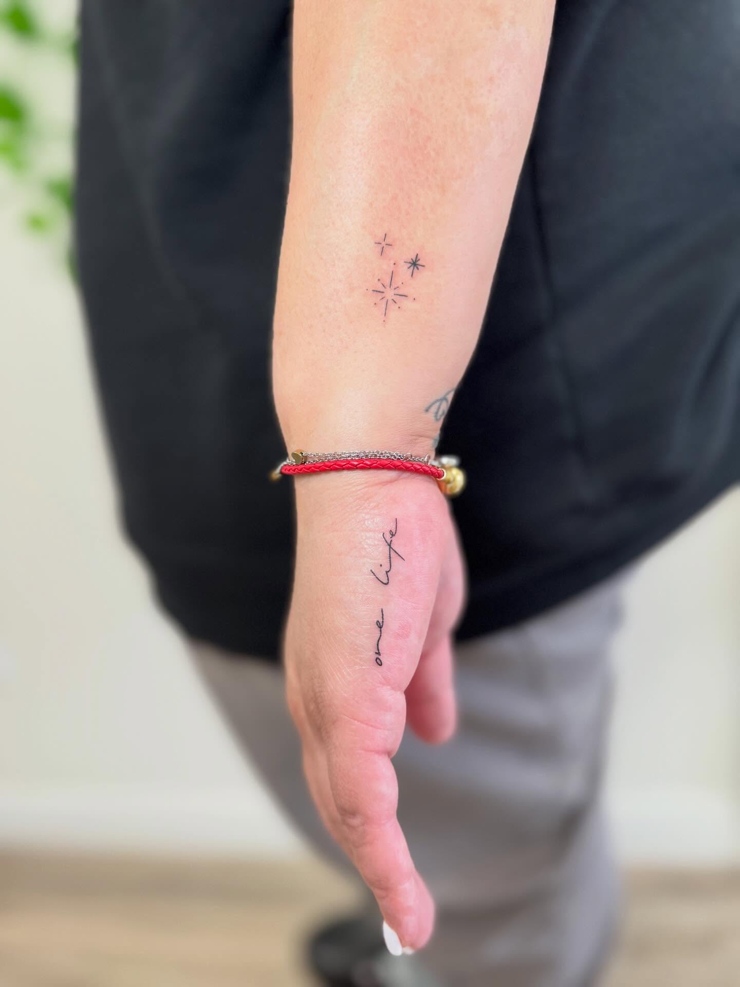 Rocket and stars fine line tattoo on the forearm by Angela Nery, South Jordan, Utah