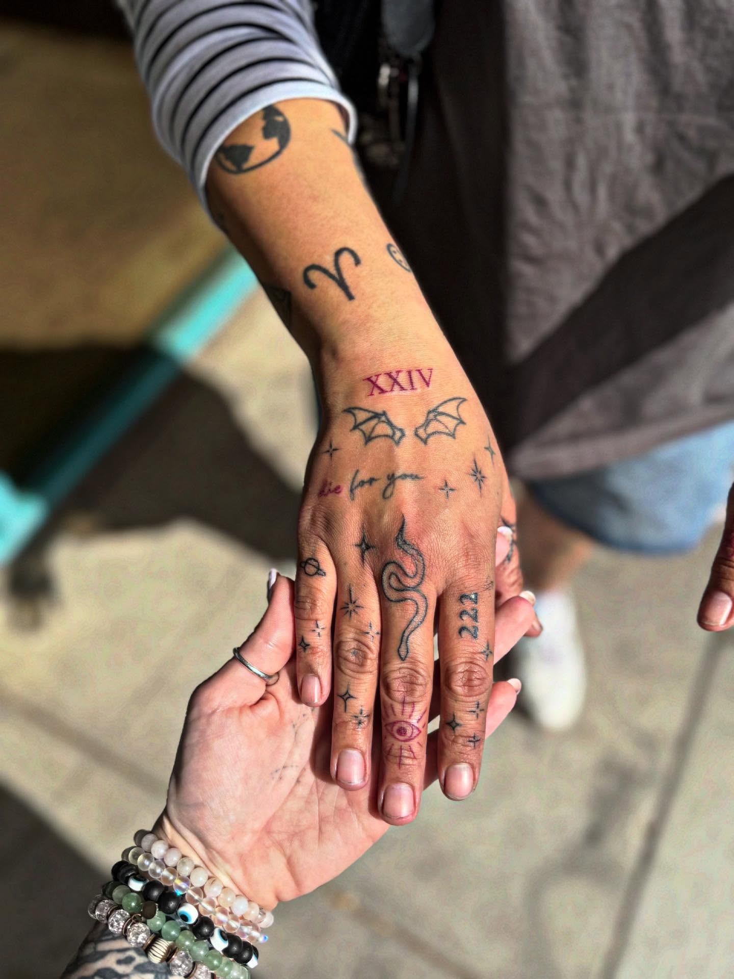 Bat and stars dotwork tattoo on the hand by McKenna Hughes