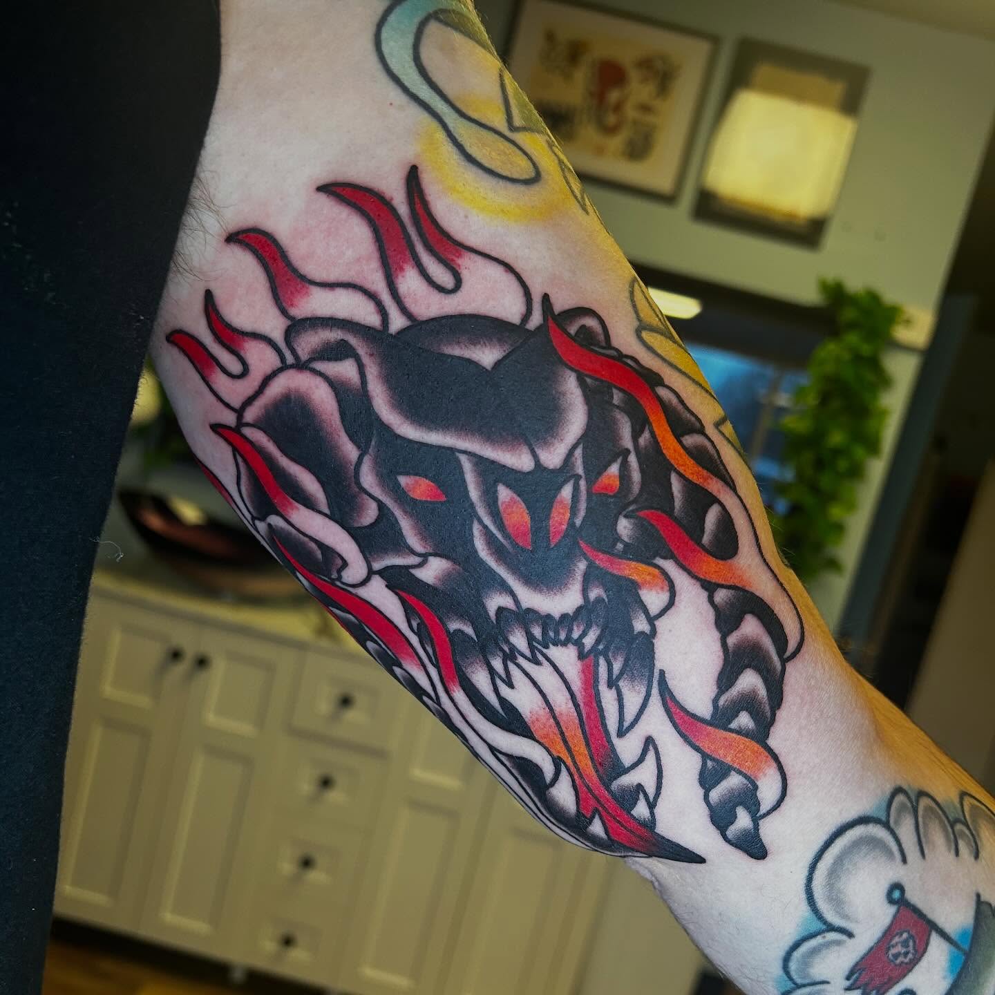 Demon skull American traditional tattoo on the forearm by Alexis Skye