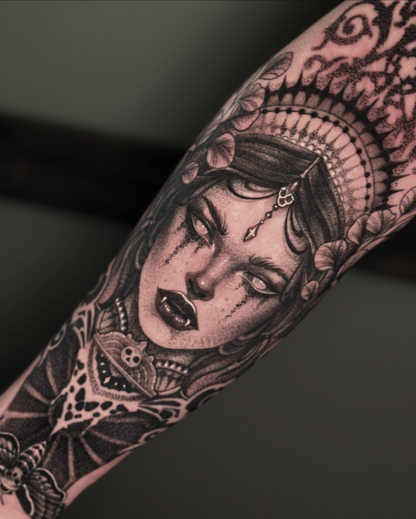 Woman's face realism tattoo on the forearm by Nick Fierro