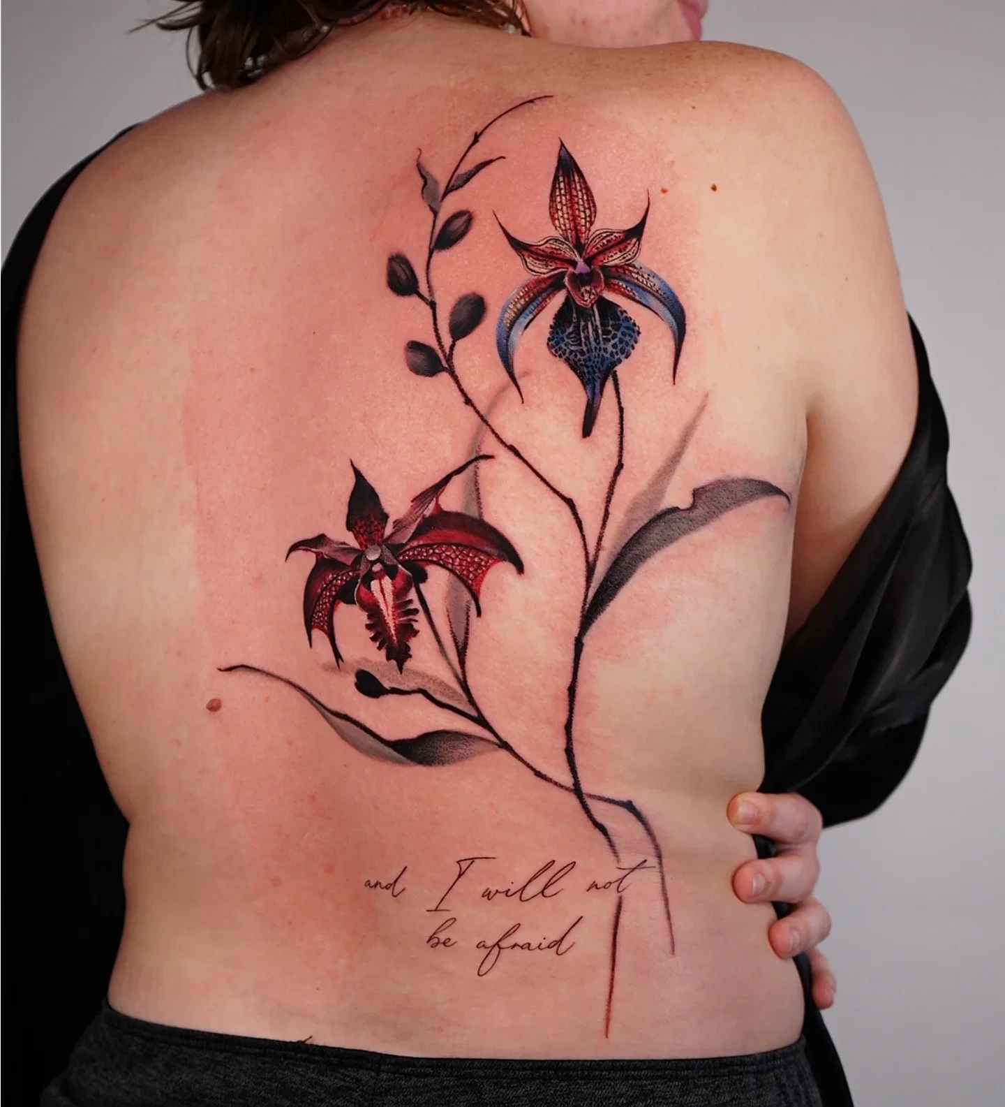 Orchids realism tattoo on the back by Vii