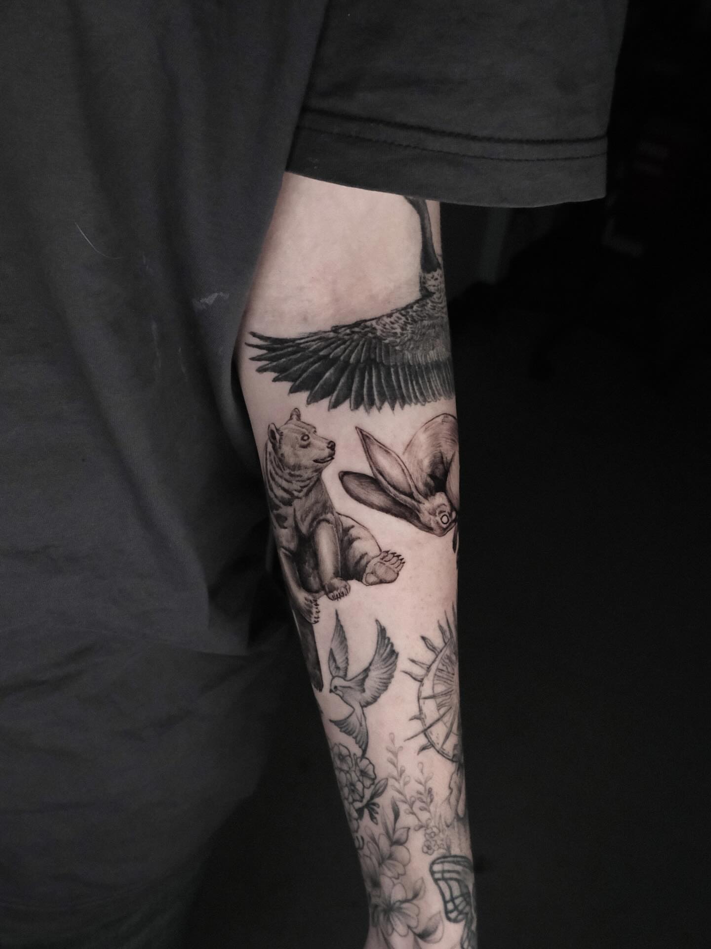 Animal motifs black and grey tattoo on the forearm by HanaKaki