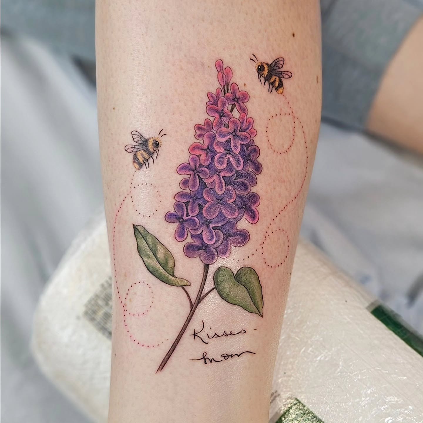 Lilac and bees dotwork tattoo on the forearm by Jordanna Pearl