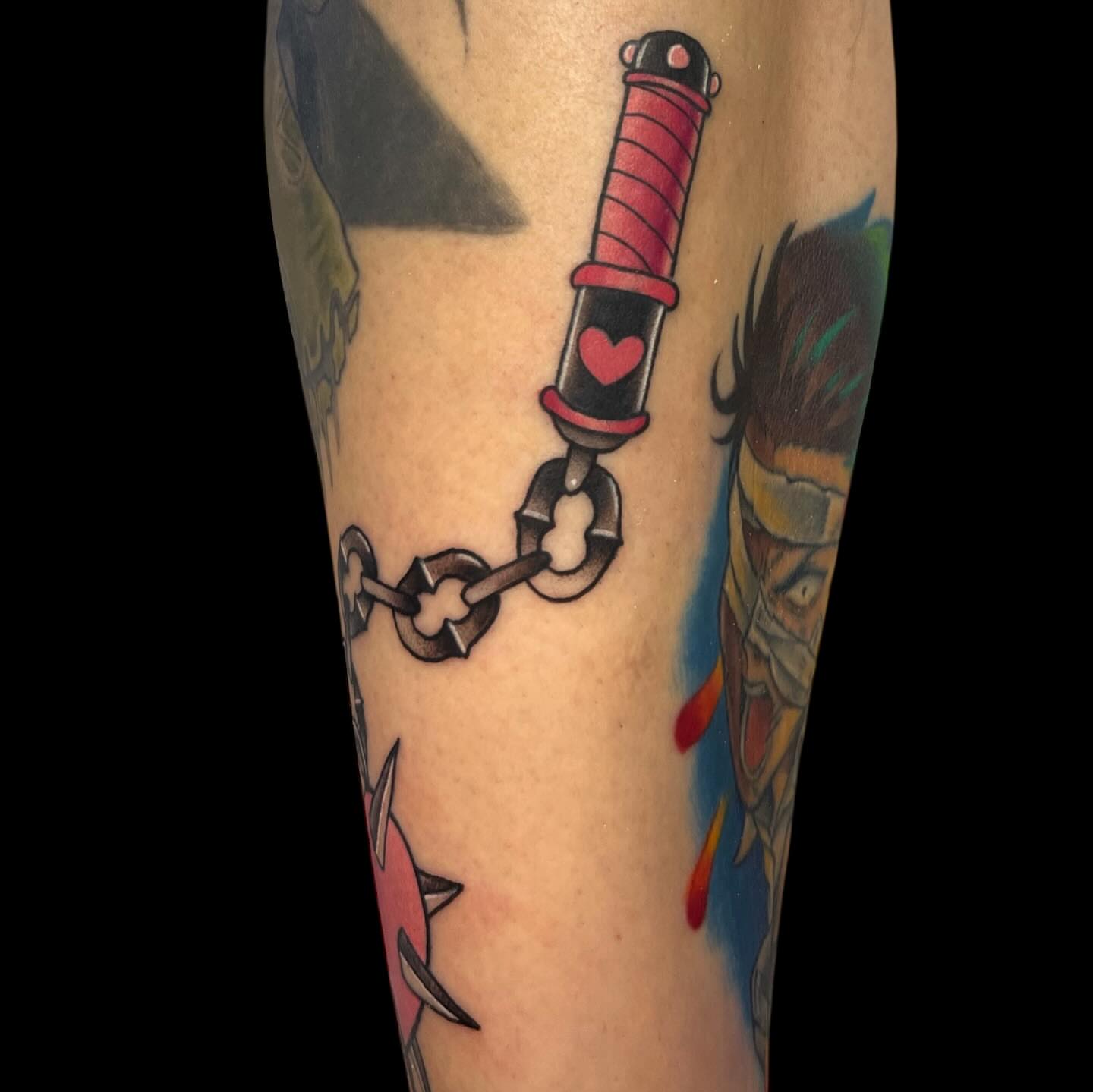 Chain and syringe American traditional tattoo on the forearm by Nicole Skalski