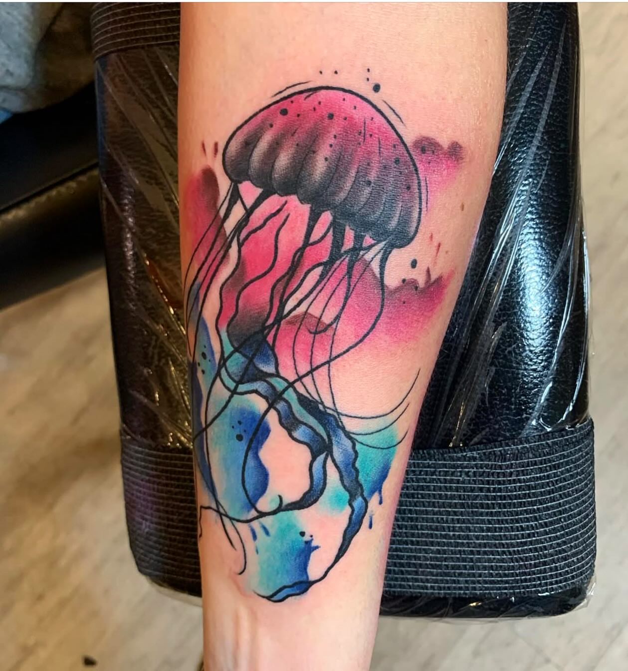 Jellyfish watercolor tattoo on the forearm by Brandon Harrison, Kansas City, Missouri