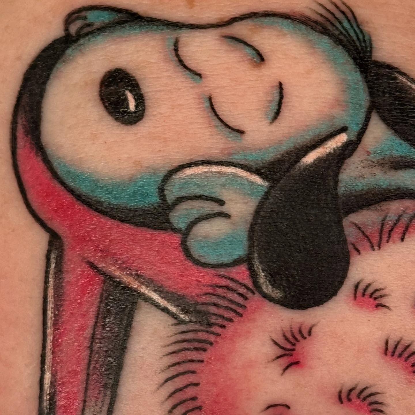 Sleeping dog American traditional tattoo on the upper arm by Megan Sue Causemaker