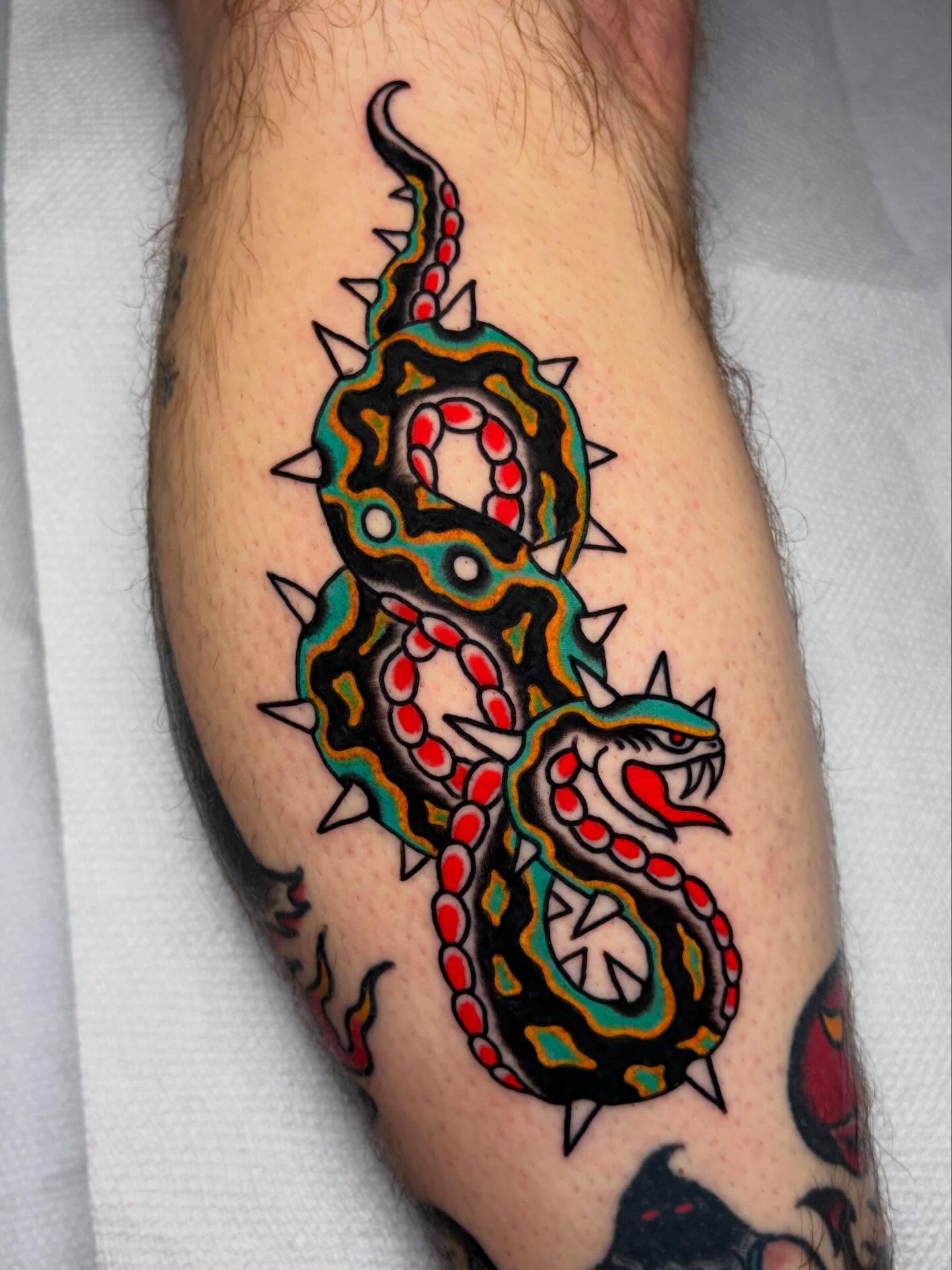 Snake American traditional tattoo on the forearm by David Armacost, Cincinnati, Ohio