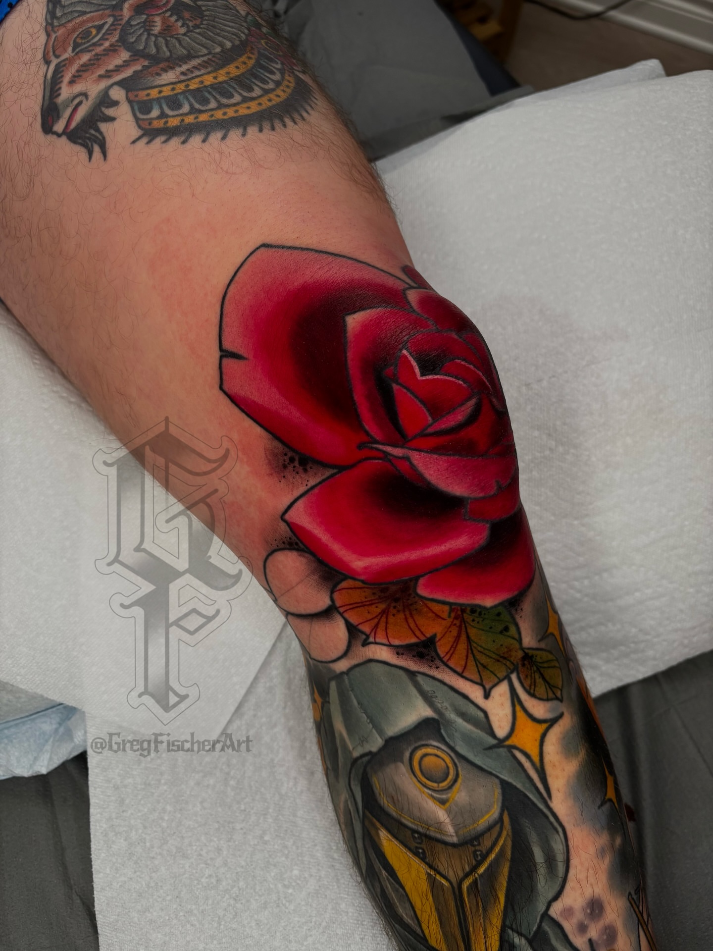 Red rose realism tattoo on the forearm by Greg Fischer