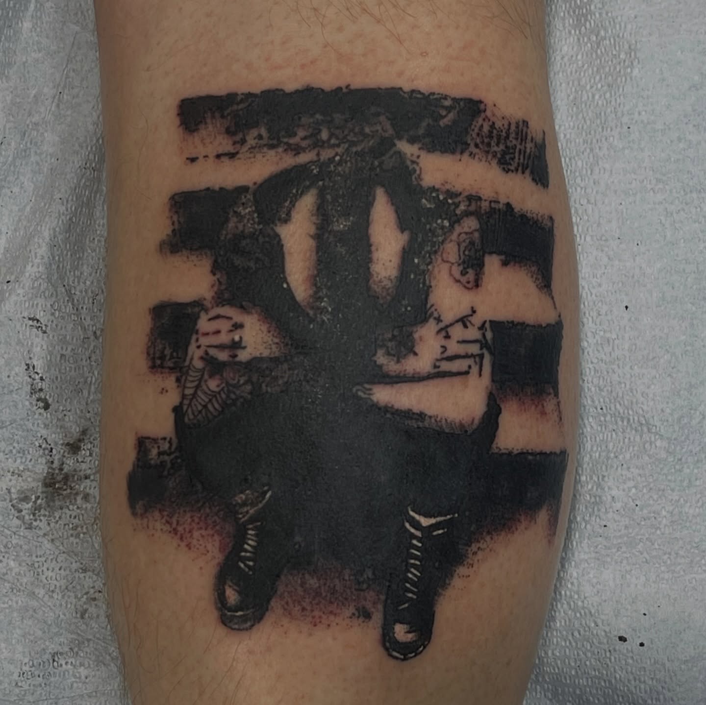 Street art black and grey tattoo on the forearm by Chris Sparks, I just go by Sparks.