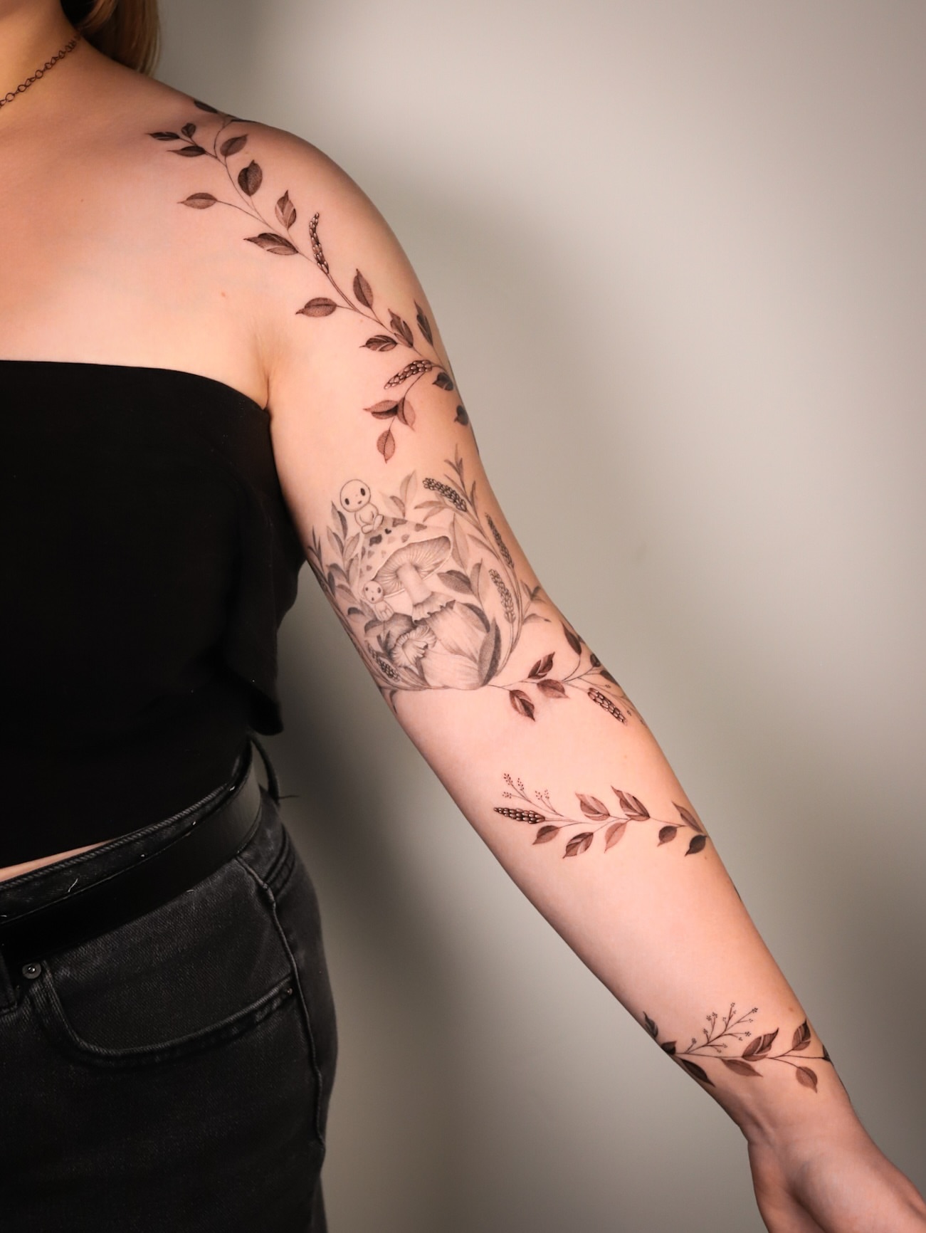 Floral arrangement black and grey tattoo on the forearm by Cyn