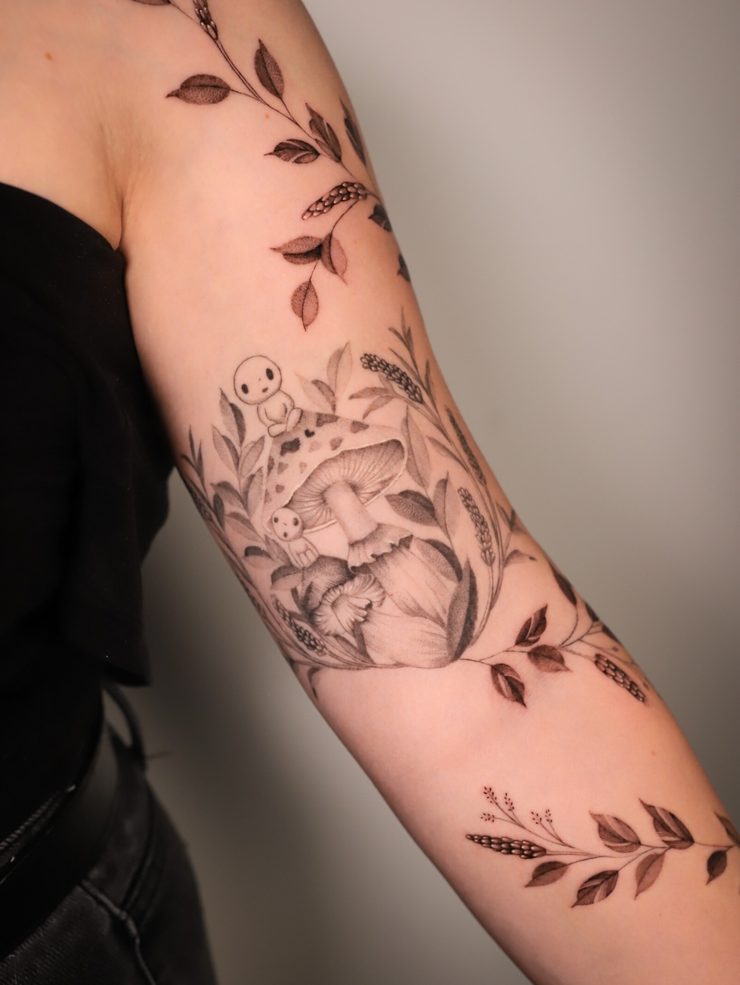 Mushroom and foliage realism tattoo on the forearm by Cyn