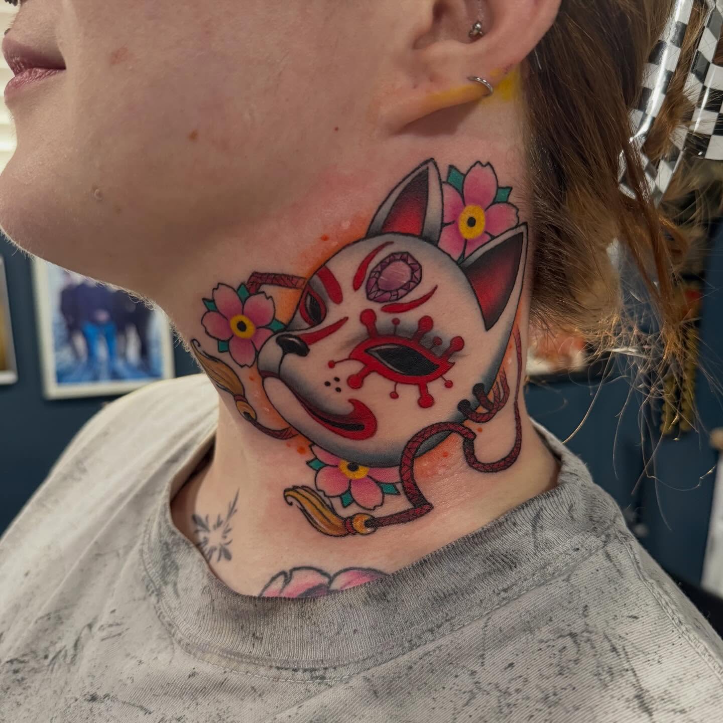 Dog mask American traditional tattoo on the neck by Matthew Gordon