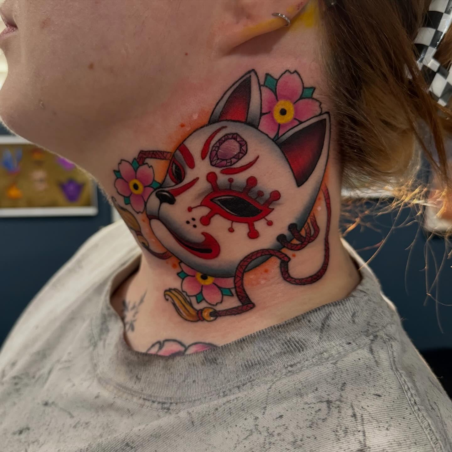 Cat with flowers Chicano tattoo on the neck by Matthew Gordon